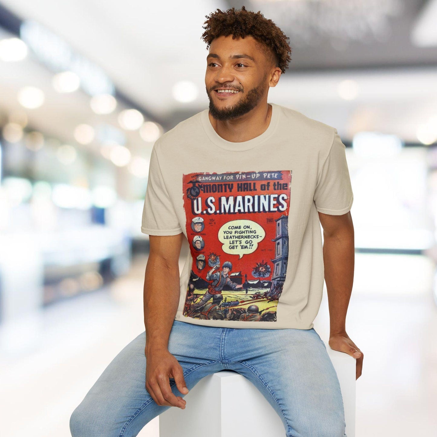 Man wearing a t-shirt with a U.S. Marines graphic design in an indoor setting