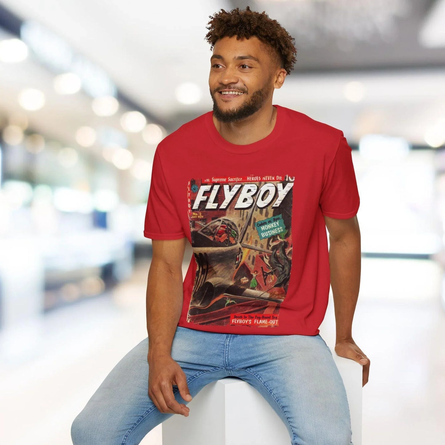 Close-up of the Flyboy No.2 unisex T-shirt's soft cotton fabric texture and double-stitched hem detail at the hemline.