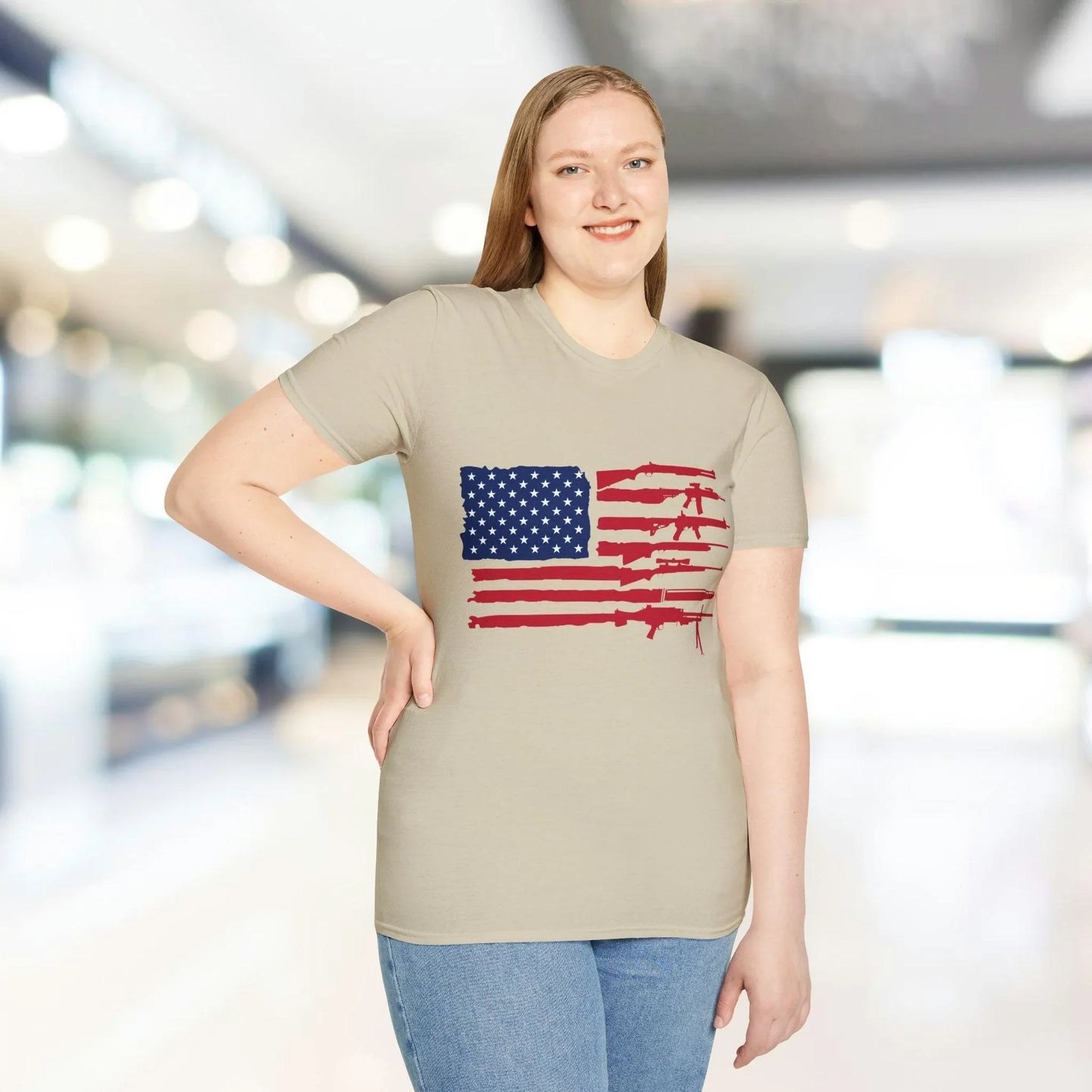 Close-up of the American Flag Guns graphic on the chest, showcasing vibrant red, white, and blue colors on soft cotton