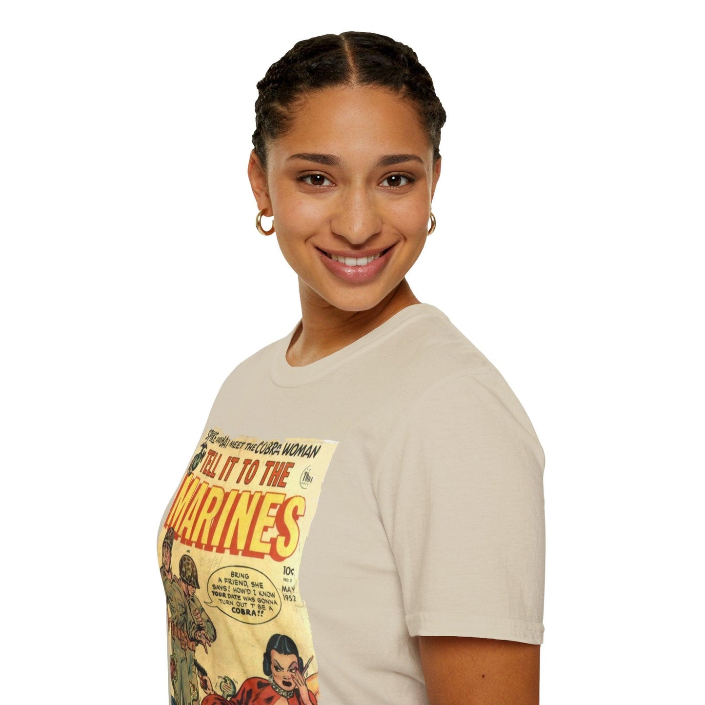 Woman wearing a beige t-shirt with a graphic design on a white background