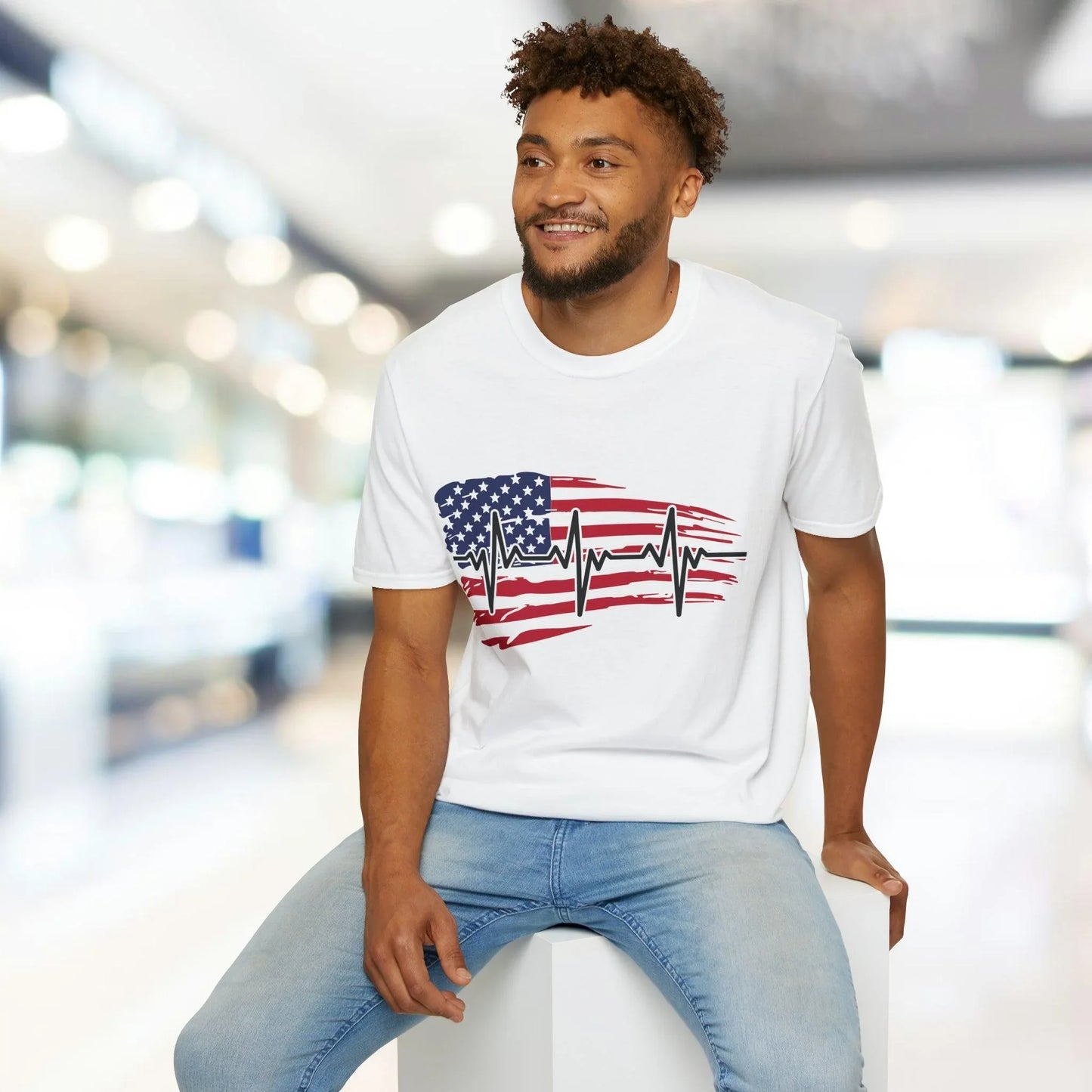 Close-up of the distressed flag heartbeat graphic on the front chest area of the unisex softstyle T-shirt, highlighting the