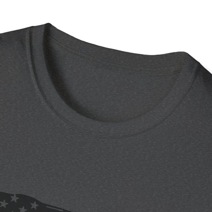 Close-up of black distressed American flag heartbeat graphic on soft cotton fabric, highlighting detailed print texture and