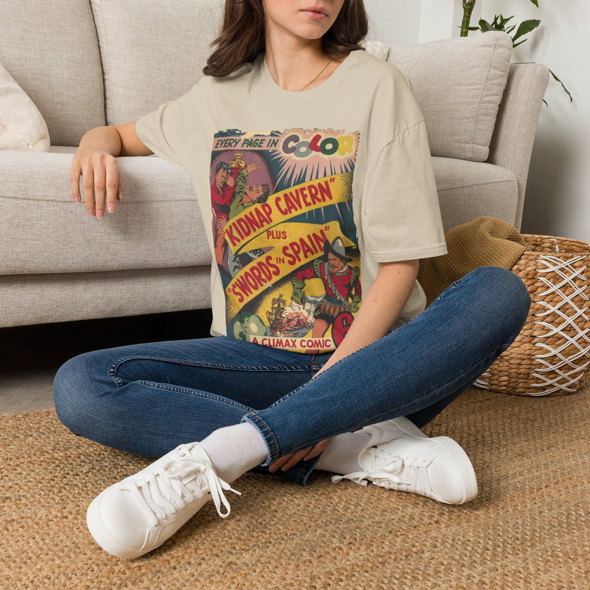 Close-up of the soft cotton fabric displaying subtle heather texture and relaxed fit neckline from a slight overhead angle.