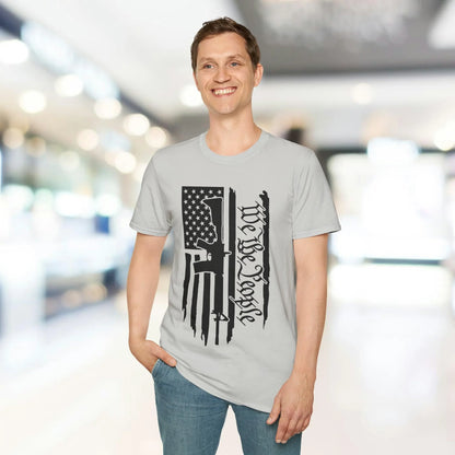 Close-up of the distressed black-and-white American flag print on the front chest area of the unisex softstyle T-shirt with