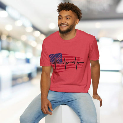 Close-up of distressed American flag heartbeat graphic on the unisex softstyle T-shirt's chest pocket area showing textured