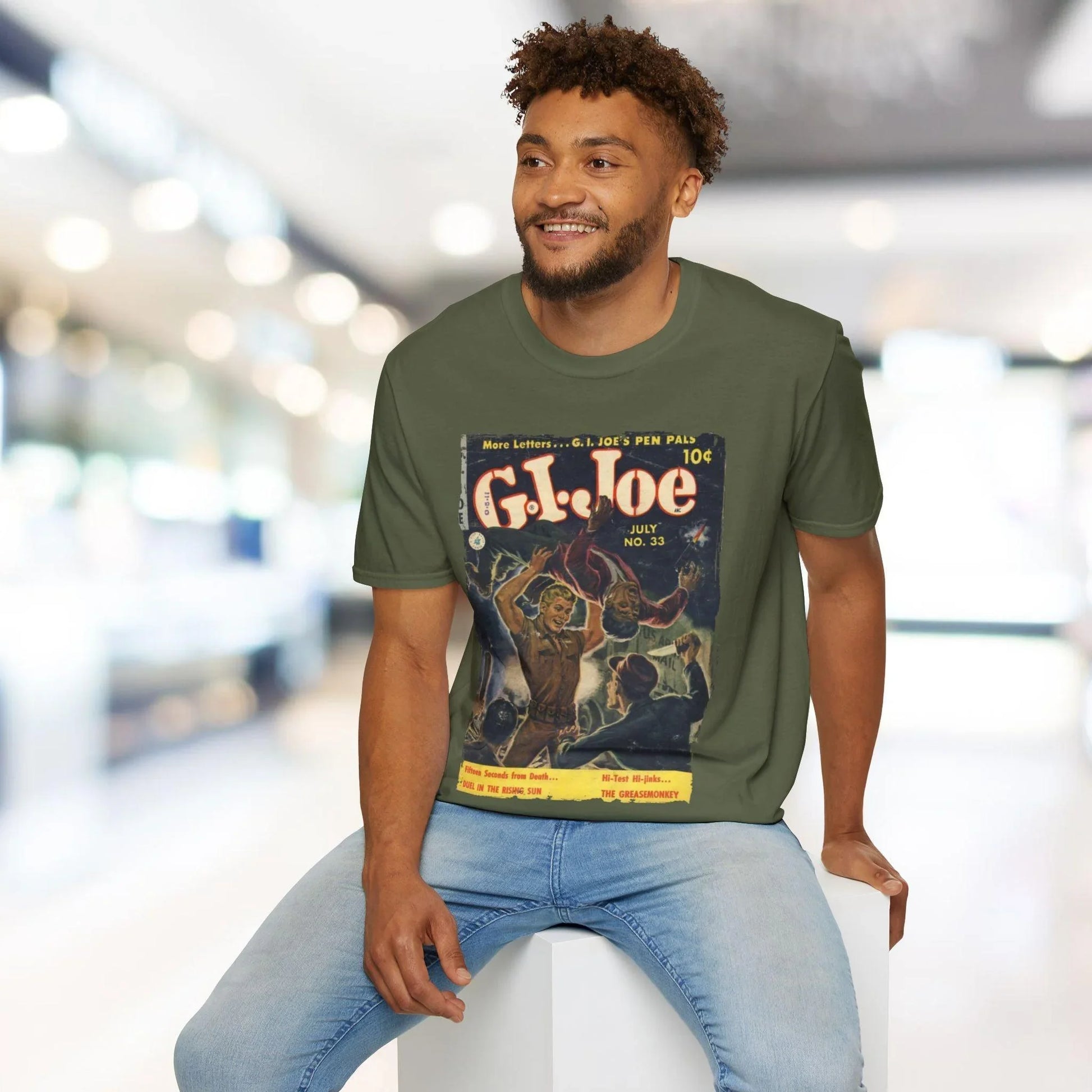 Close-up of the G.I. Joe No.33 unisex softstyle T-shirt's collar stitching and smooth fabric texture from a front angle.