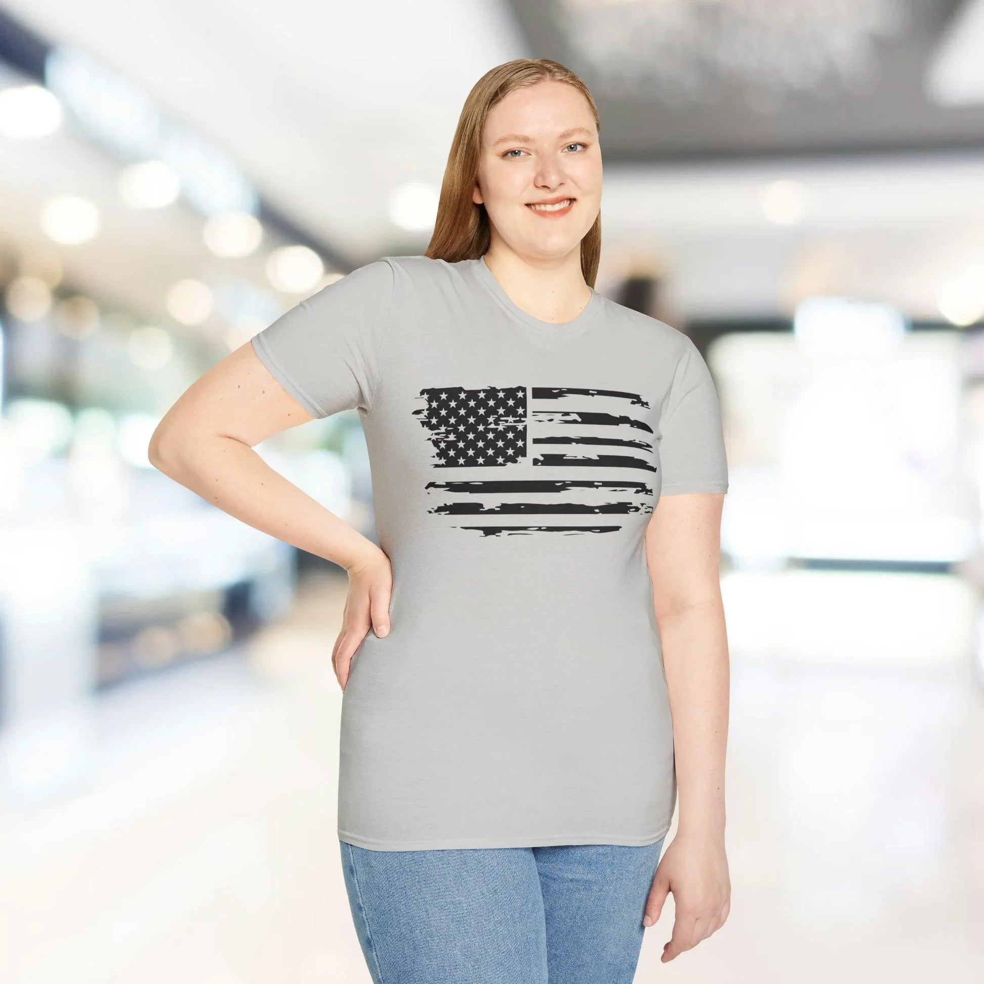 Close-up of distressed American flag black and white graphic on soft cotton fabric showcasing subtle faded details and