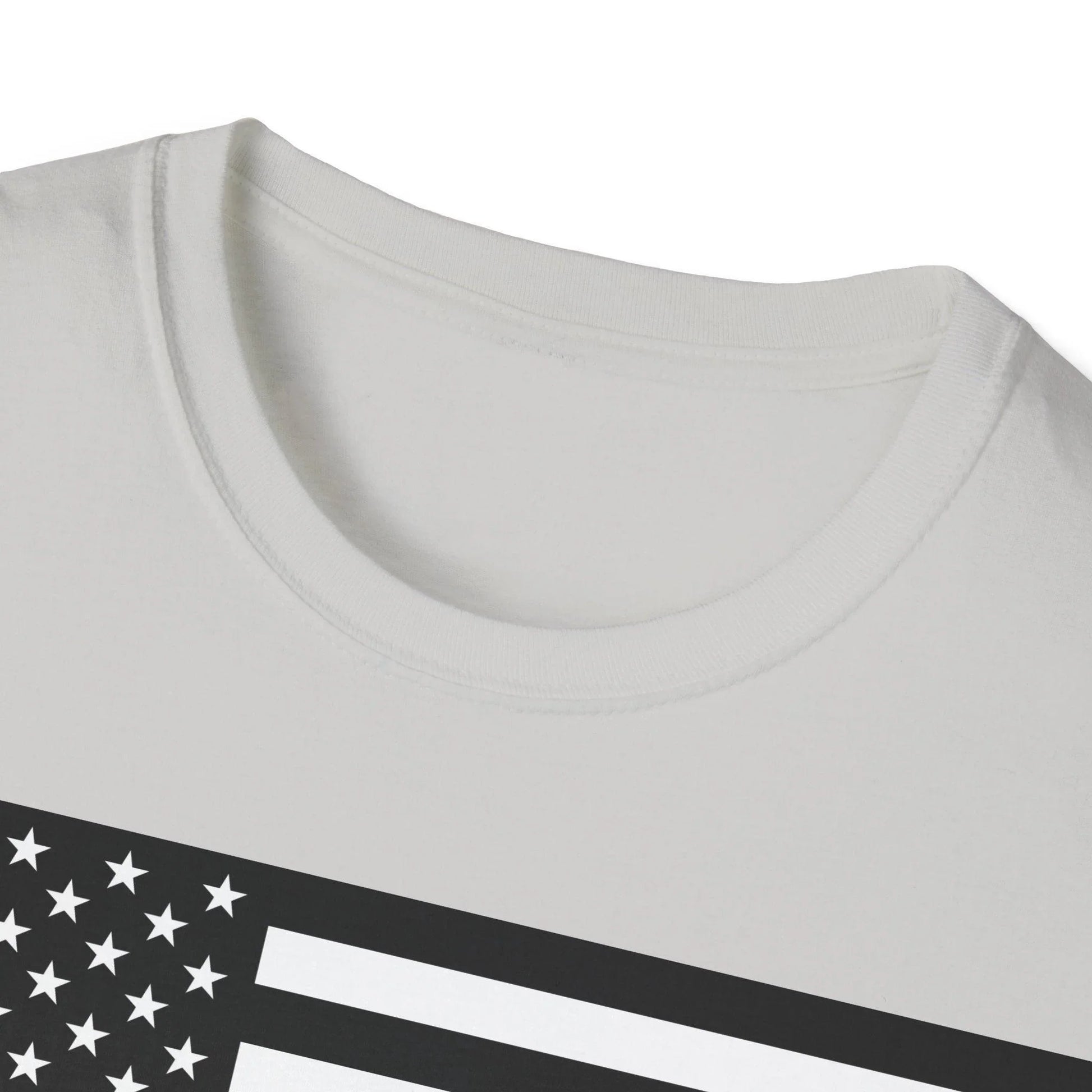 Close-up of black and white American Flag heartbeat graphic on the chest area, showcasing crisp print details and fabric