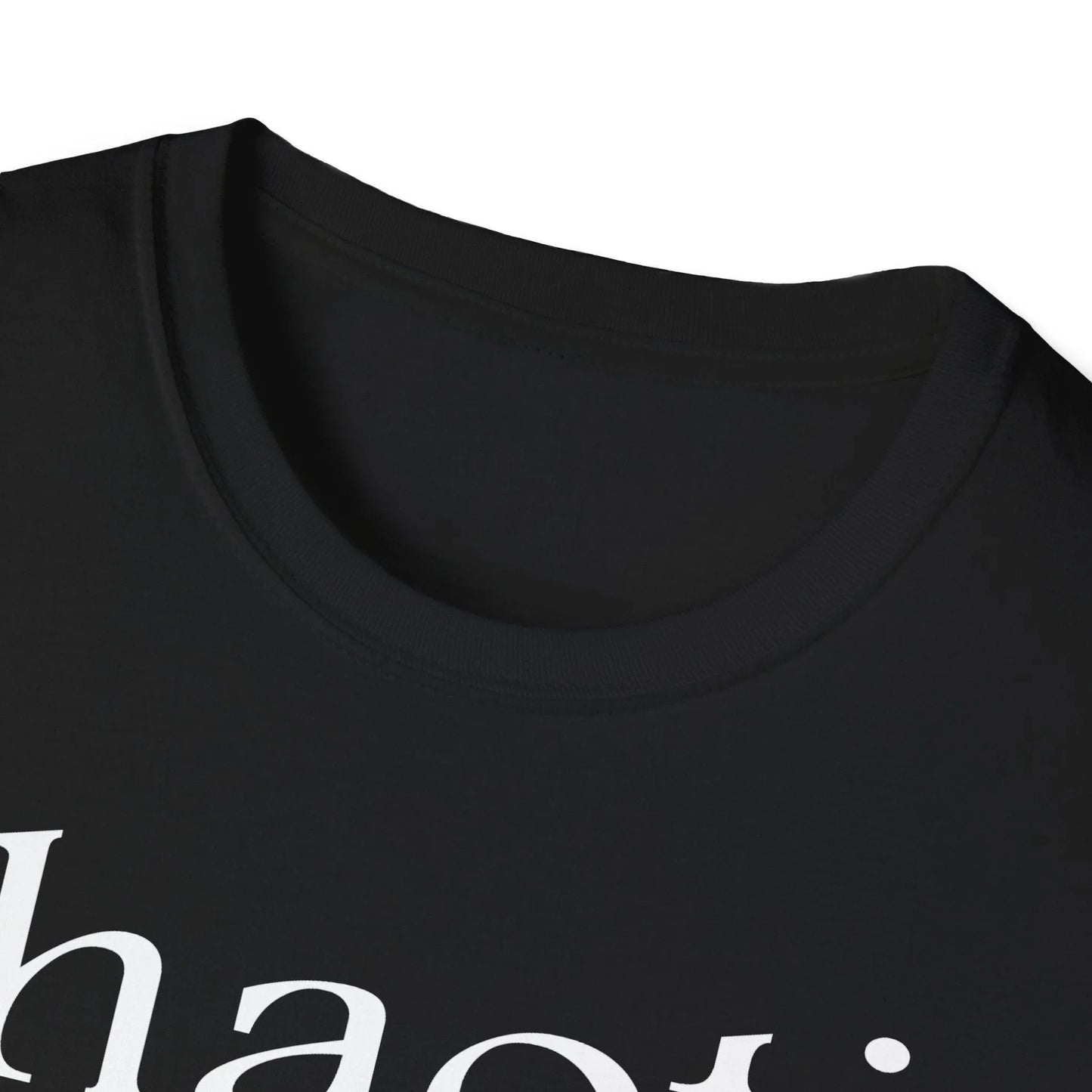 Close-up of the white cotton fabric showing smooth texture and subtle stitching detail along the neckline seam.