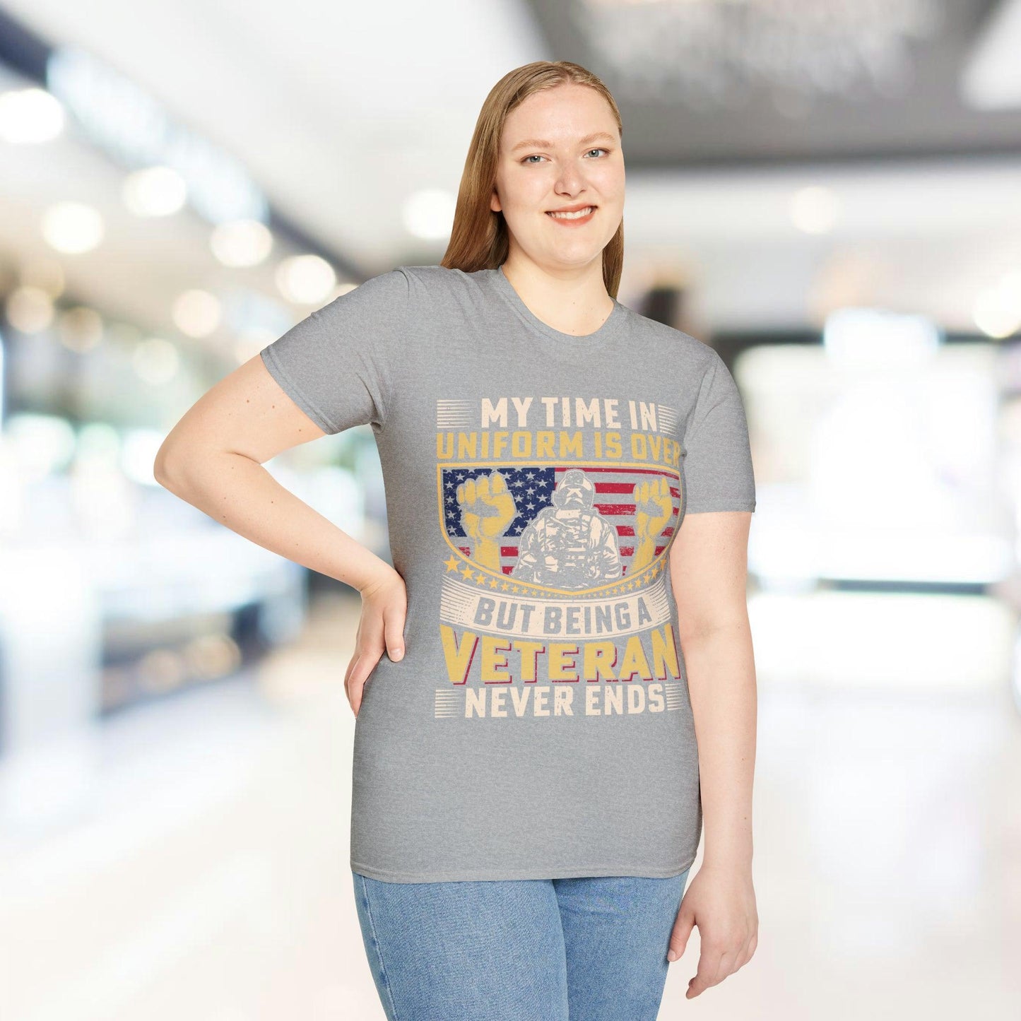 Close-up of the unisex softstyle fabric in charcoal gray, highlighting smooth texture and relaxed fit neckline from a front