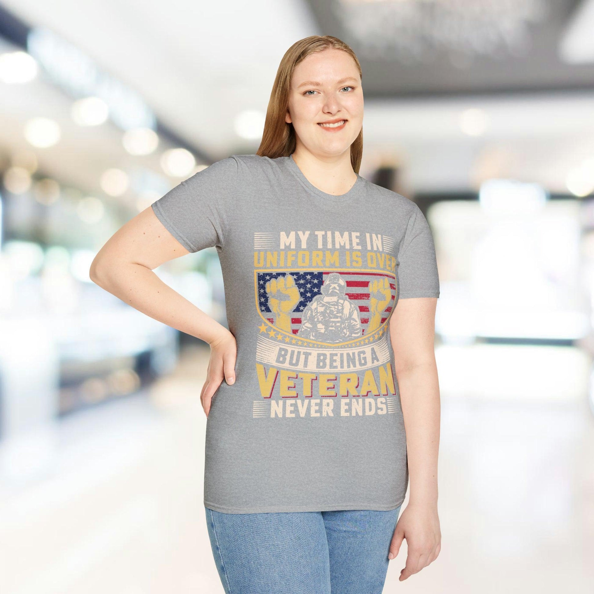 Close-up of the unisex softstyle fabric in charcoal gray, highlighting smooth texture and relaxed fit neckline from a front