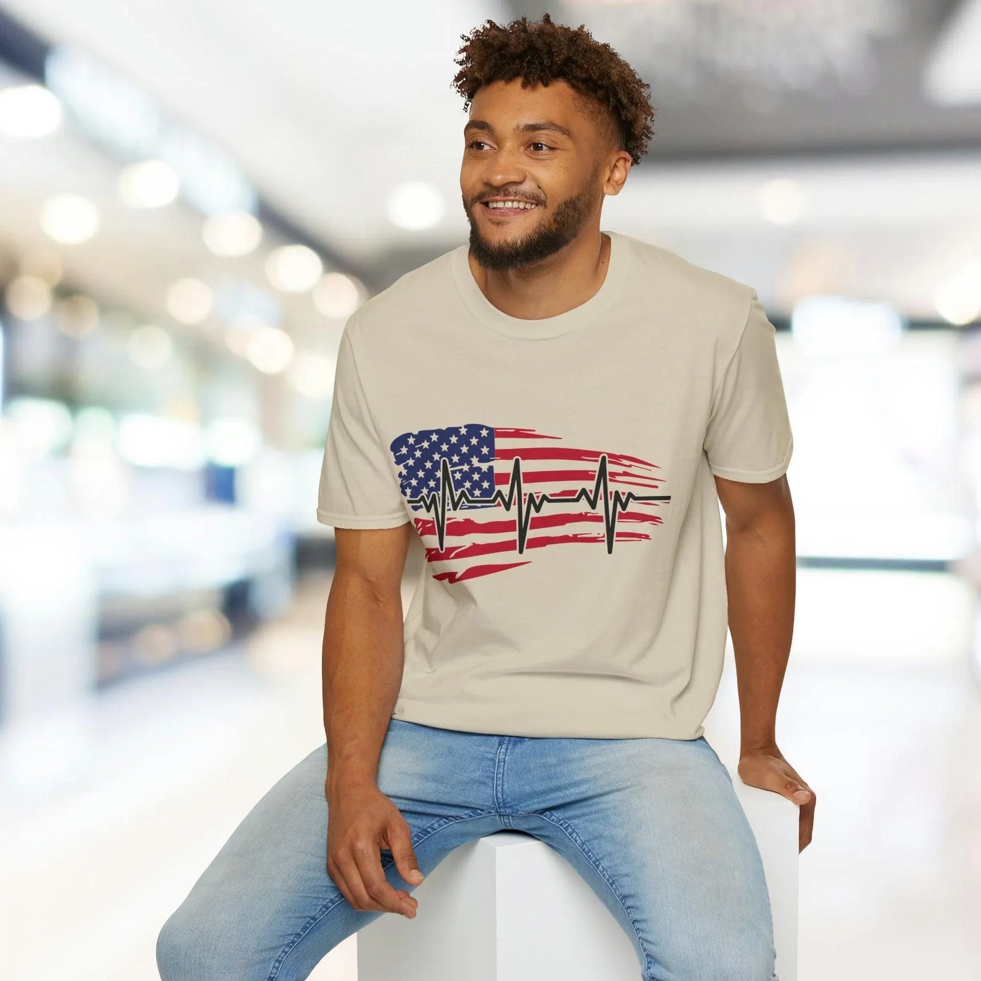 Close-up of the distressed American flag heartbeat graphic on soft navy fabric, highlighting textured print detail and