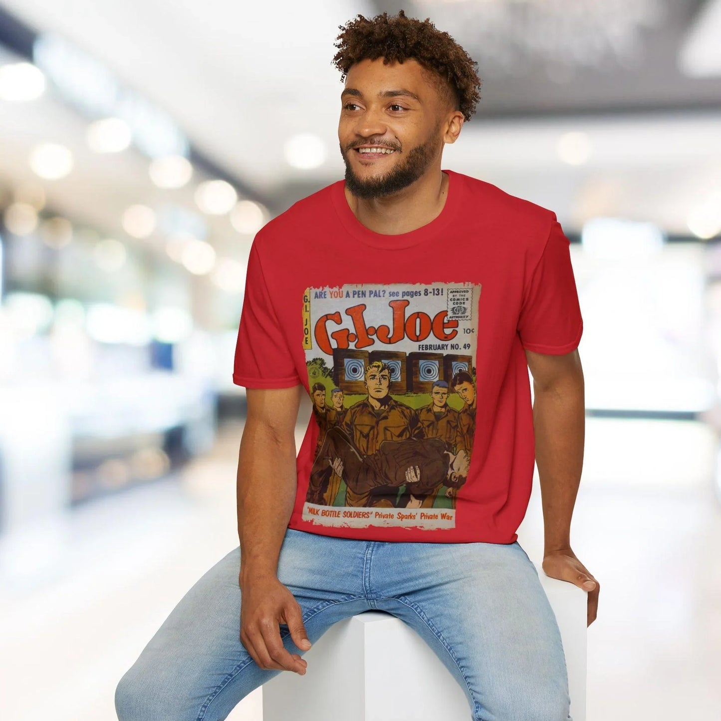 Close-up of the G.I. Joe No.49 softstyle T-shirt’s neckline and tag detail showing relaxed fit and dark olive color from an