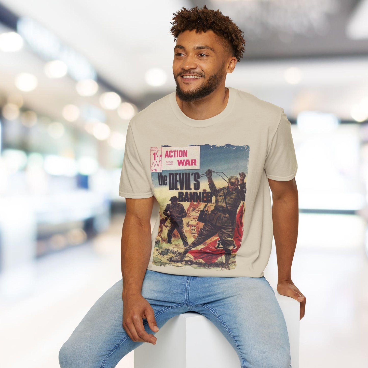 Close-up of the unisex softstyle T-shirt's textured fabric and subtle stitching at the hem in vibrant red color.