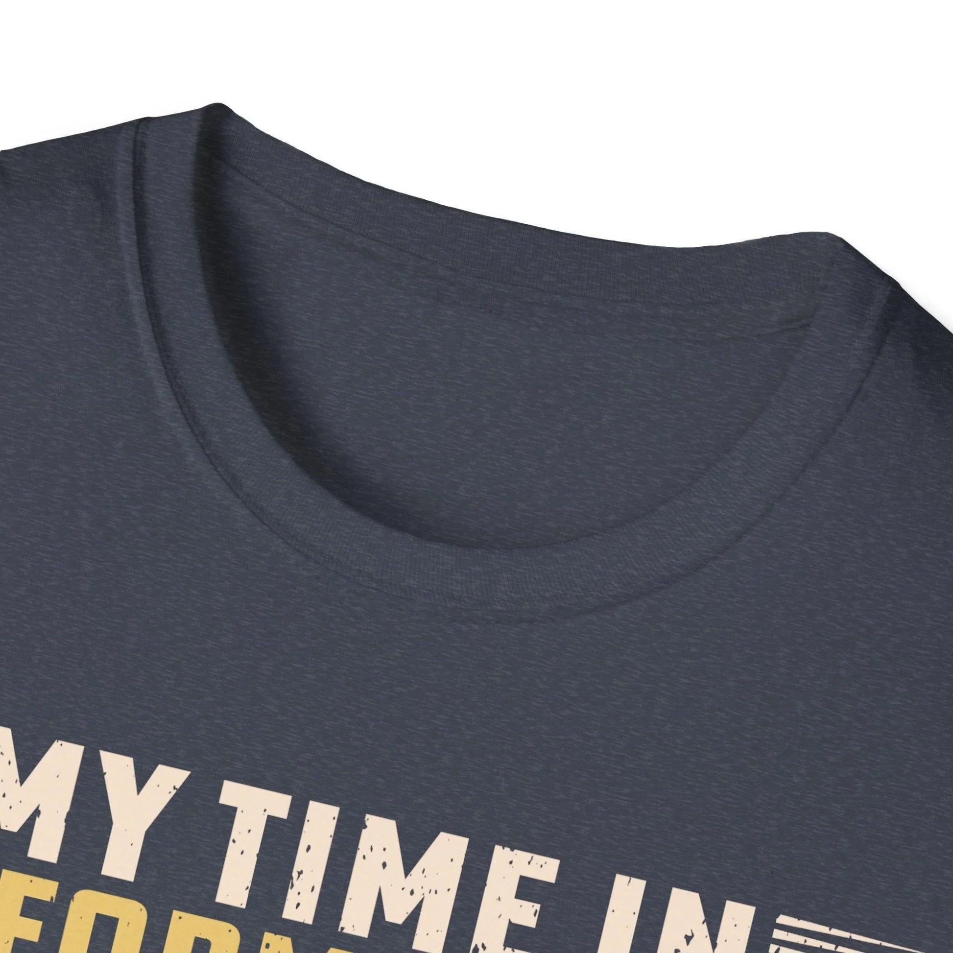 Close-up of the unisex fit label on the back neckline showing "Being A Veteran Never Ends" text on soft blue cotton fabric