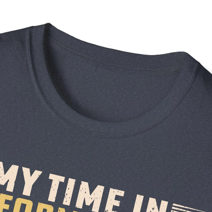 Close-up of the unisex fit label on the back neckline showing "Being A Veteran Never Ends" text on soft blue cotton fabric