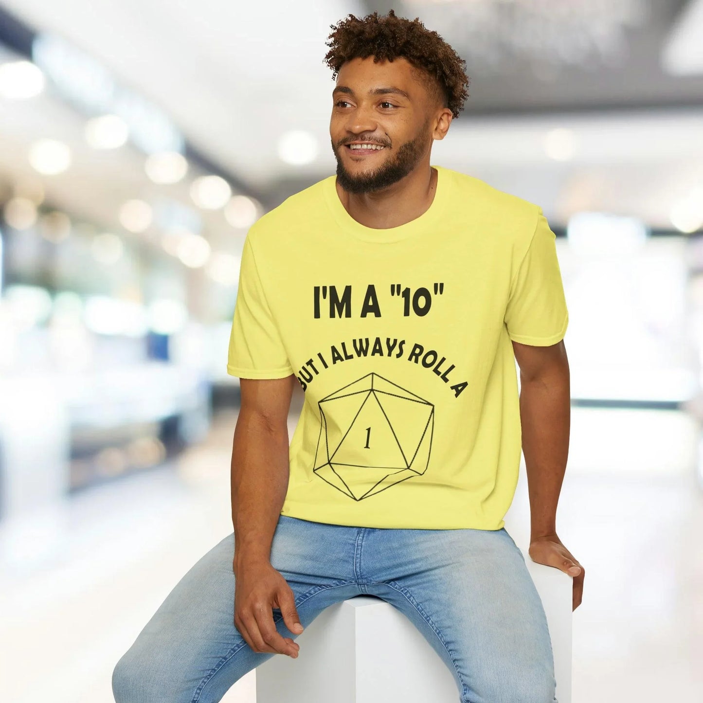 Close-up of the black unisex softstyle fabric showing subtle creases and relaxed fit, highlighting the comfortable knit