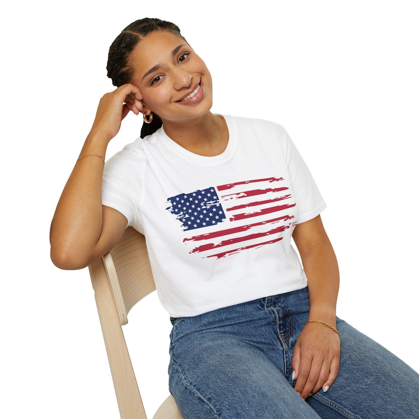 Close-up of the distressed American flag print on soft cotton fabric, highlighting vintage-inspired wear detail on the chest