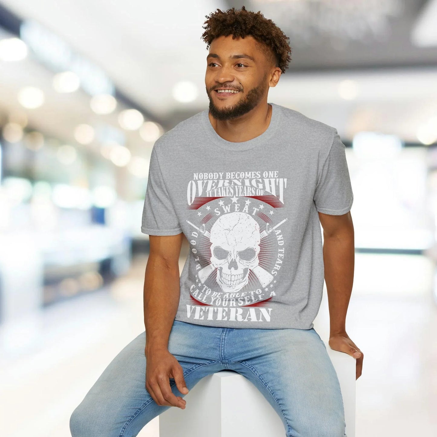 Close-up of the unisex T-shirt's relaxed fit collar and subtle heather gray fabric texture from a front-side angle