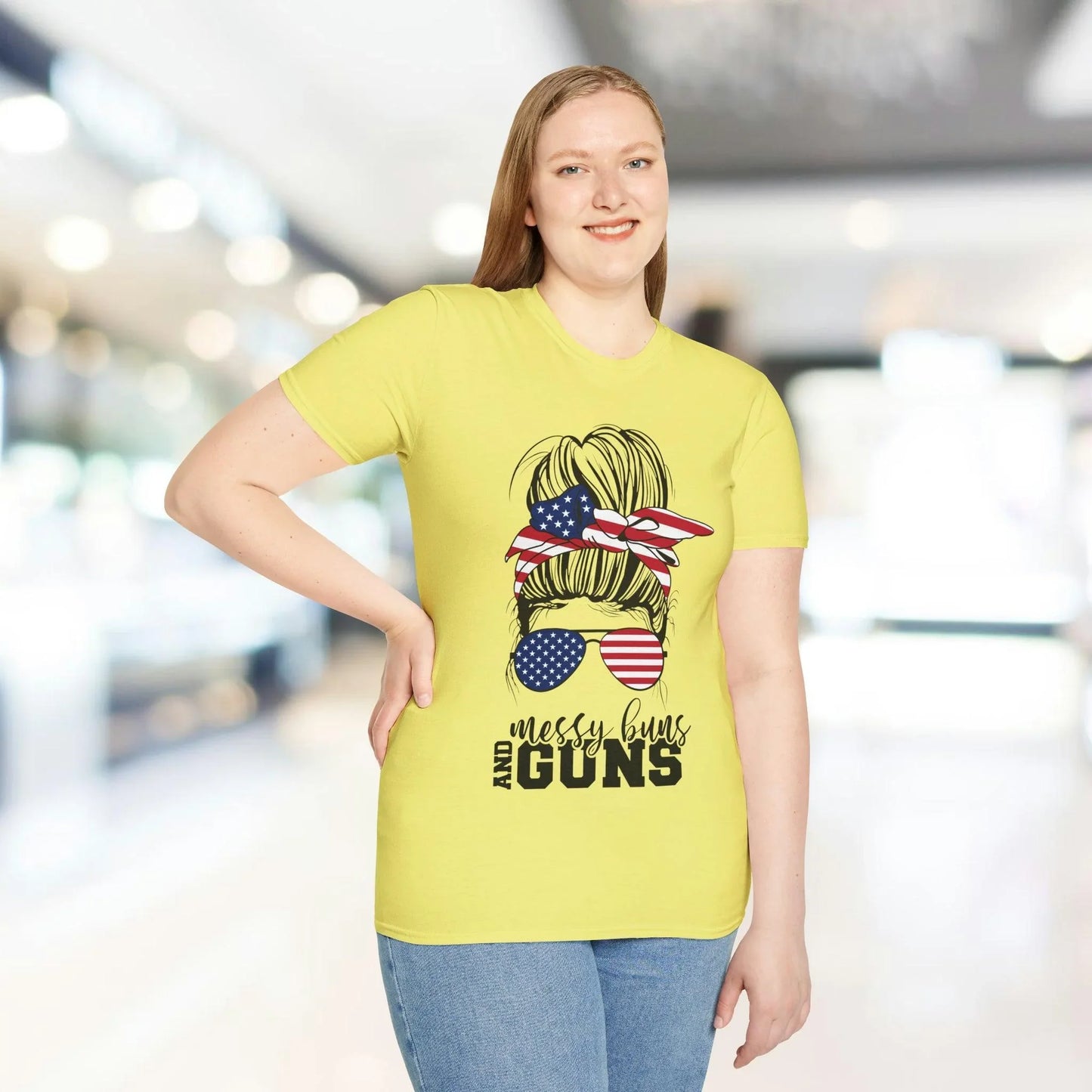 Close-up of the relaxed fit, heather gray fabric showing soft texture and subtle stitching details on the Messy Buns & Guns