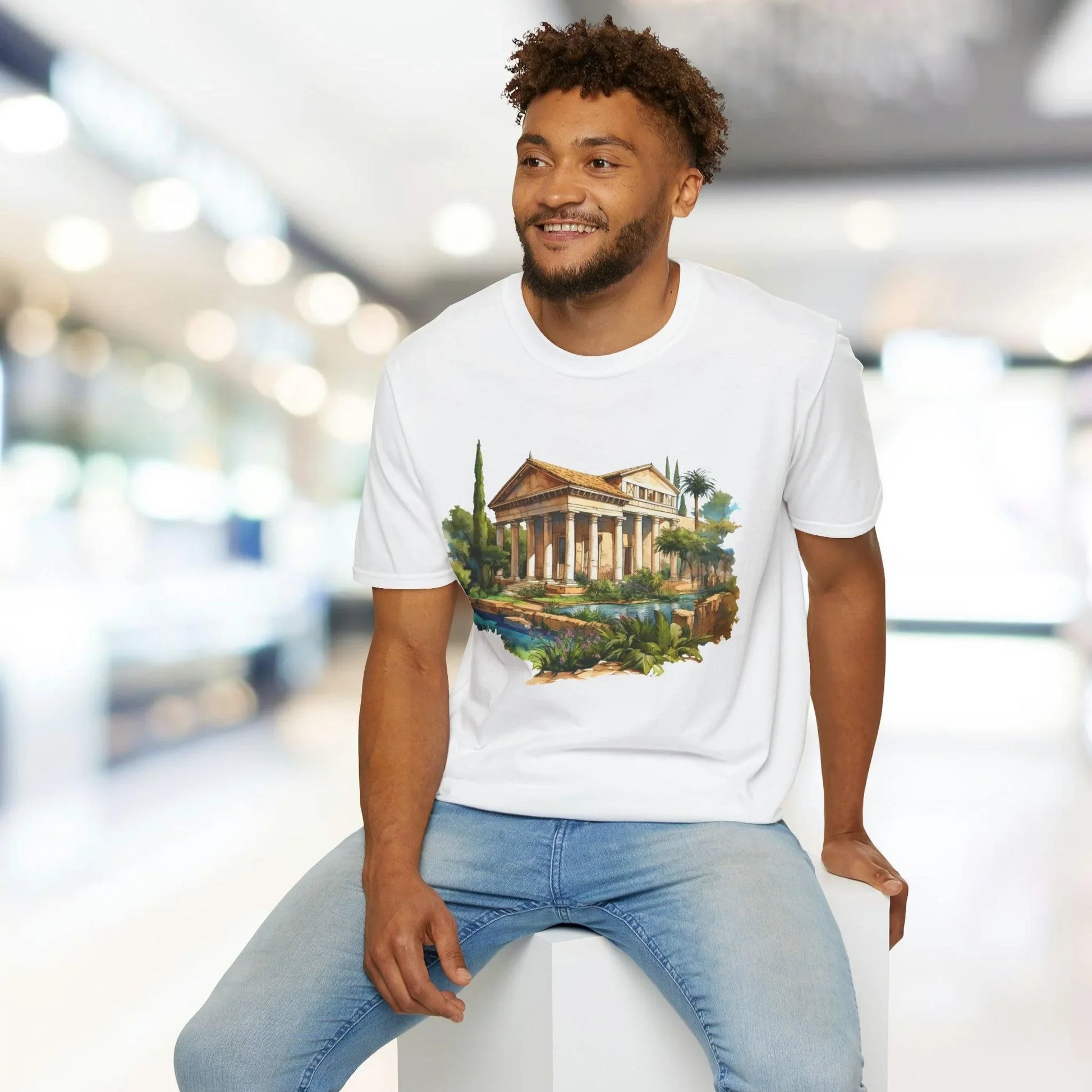 Close-up of the unisex softstyle fabric label stitched at the hem showing material details and brand logo in natural