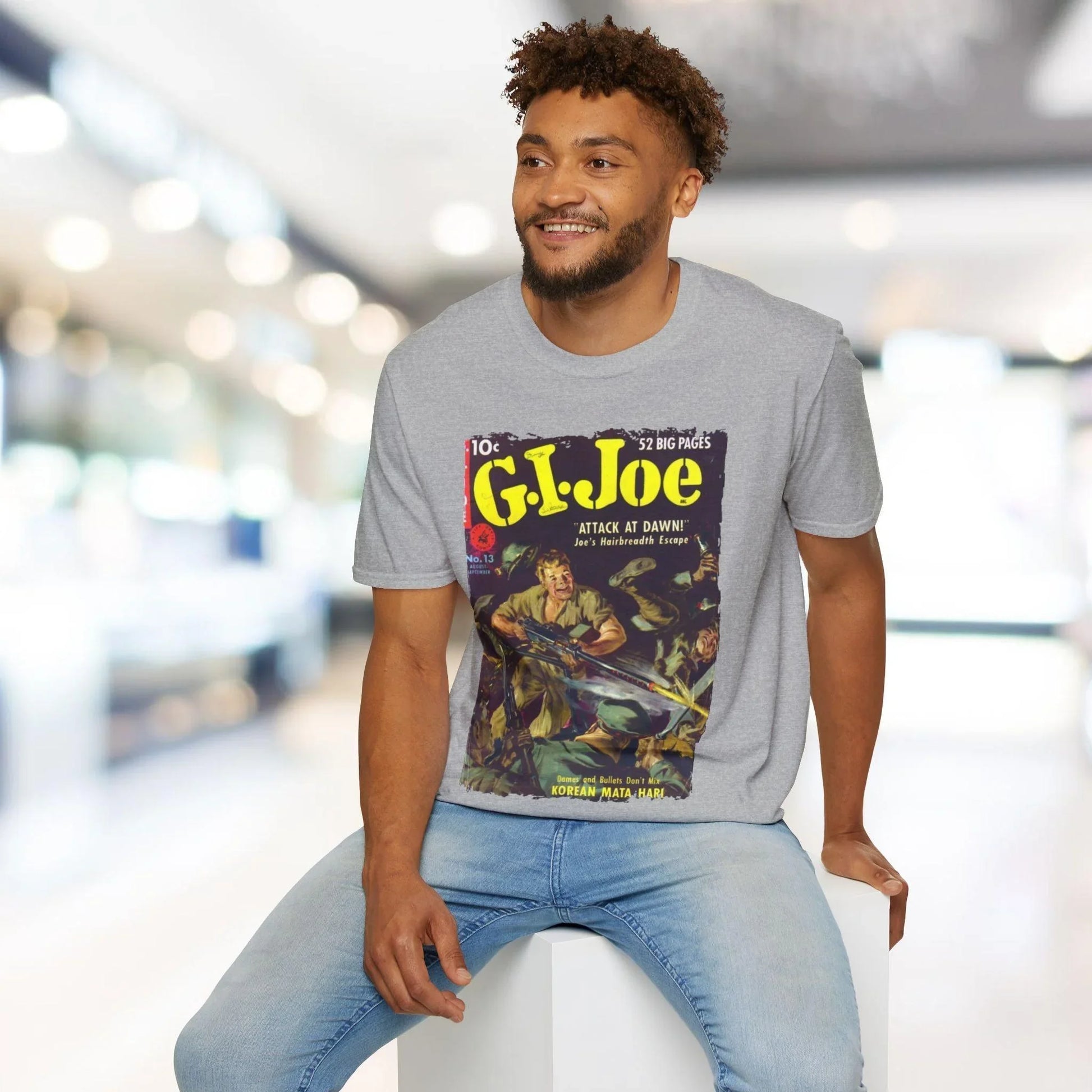 Close-up of the unisex softstyle fabric tag on the hem displaying the G.I. Joe No.13 branding and care instructions