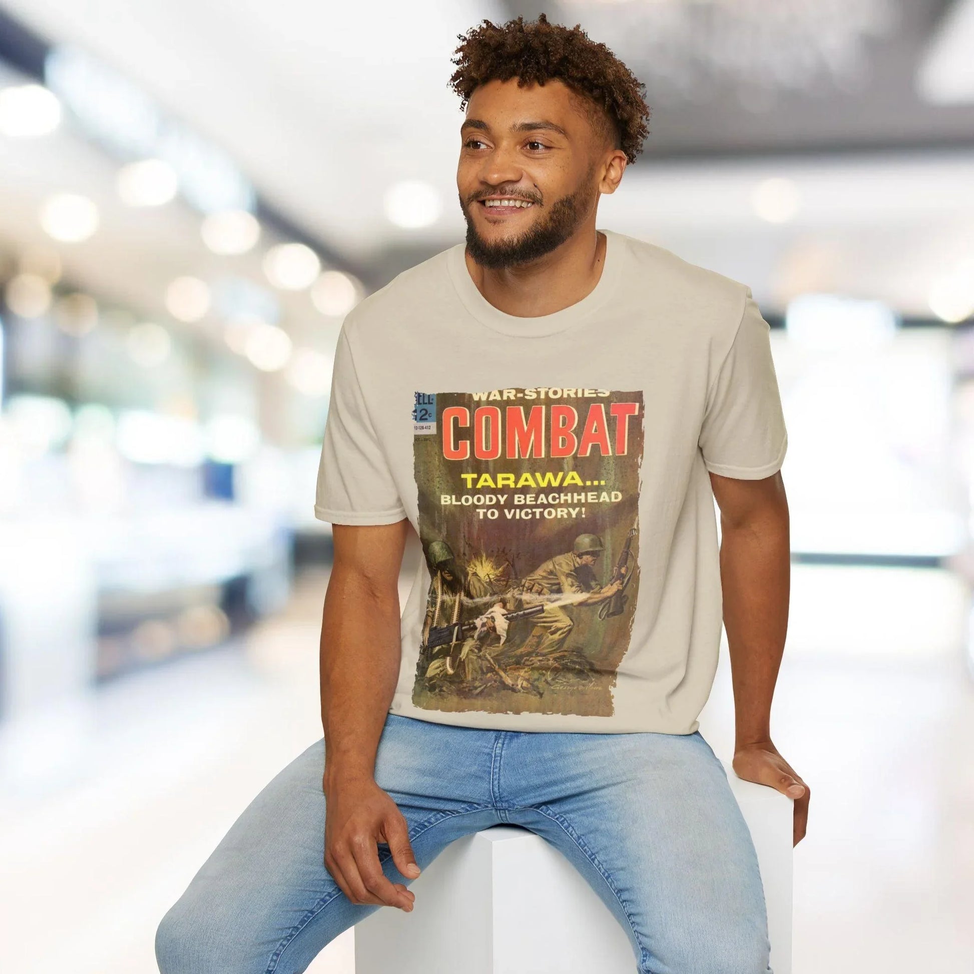 Close-up of the Combat Dec 1964 unisex softstyle T-shirt's subtle neckline label on relaxed-fit heather gray fabric.