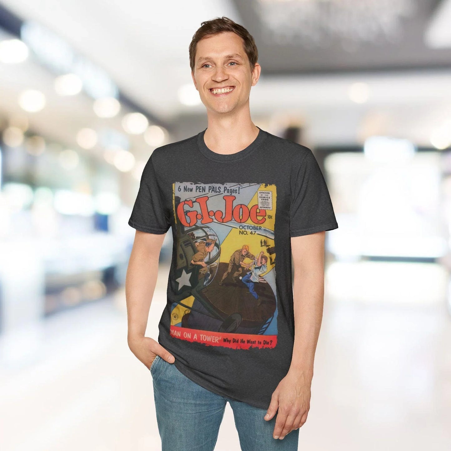 Close-up of the G.I. Joe No.47 softstyle label sewn onto the forest green, relaxed fit T-shirt's lightweight cotton fabric.