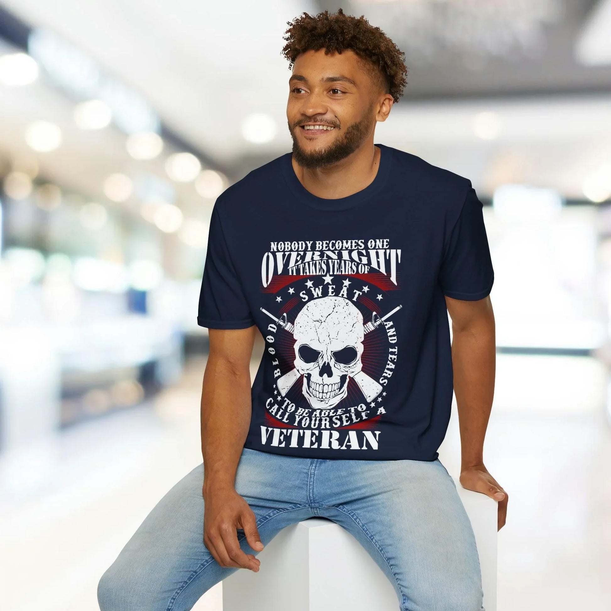 Close-up of the unisex softstyle T-shirt's navy fabric showing subtle heather texture and reinforced crew neckline stitching.