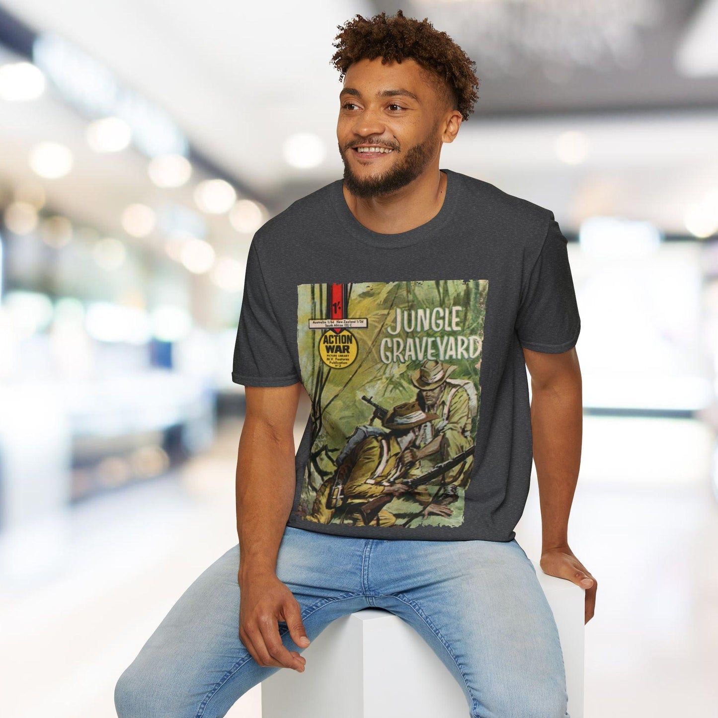 Close-up of the unisex relaxed fit T-shirt's navy color and soft cotton fabric texture from a downward angle, highlighting