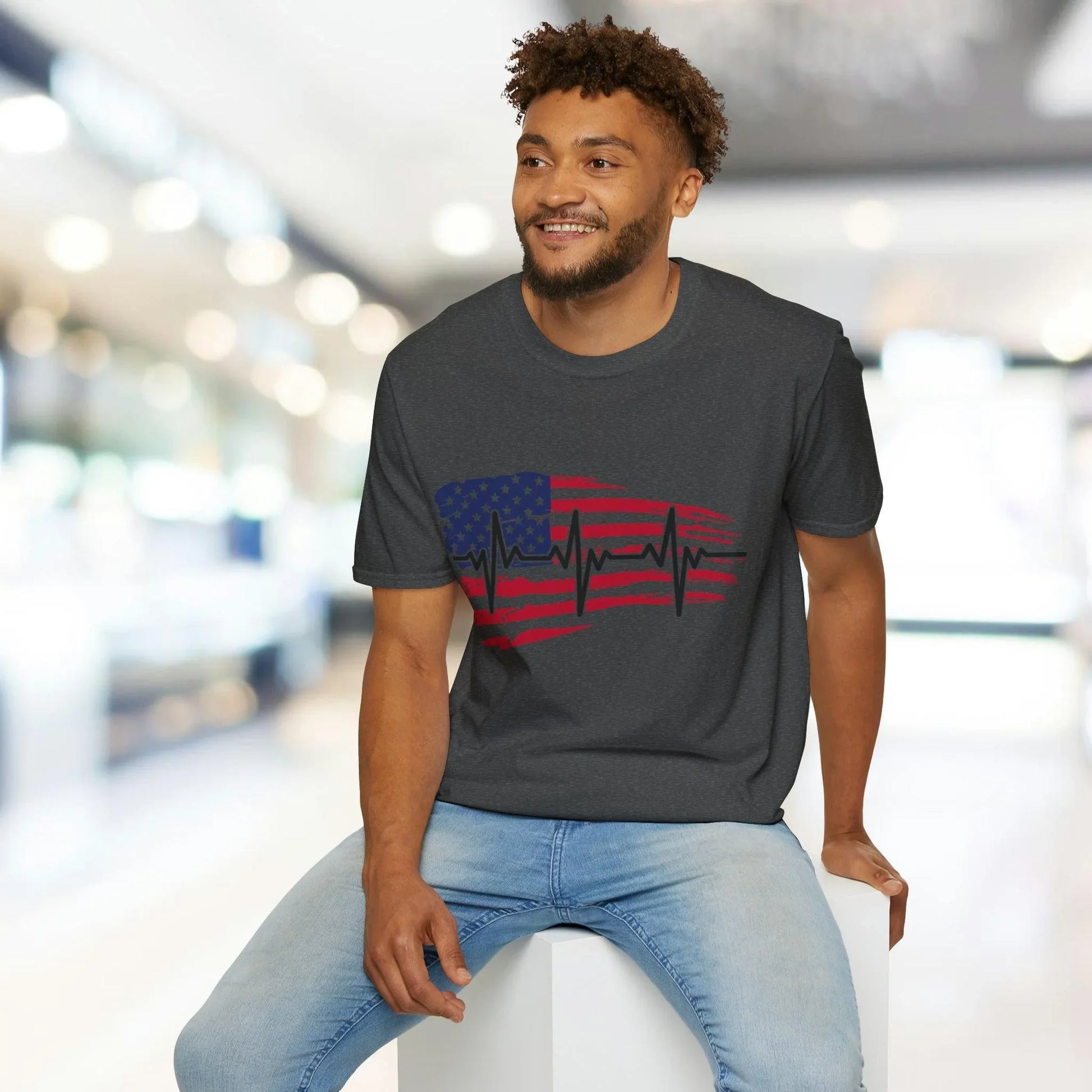 Close-up of the distressed flag heartbeat graphic printed on the soft cotton fabric with a relaxed fit and crew neckline