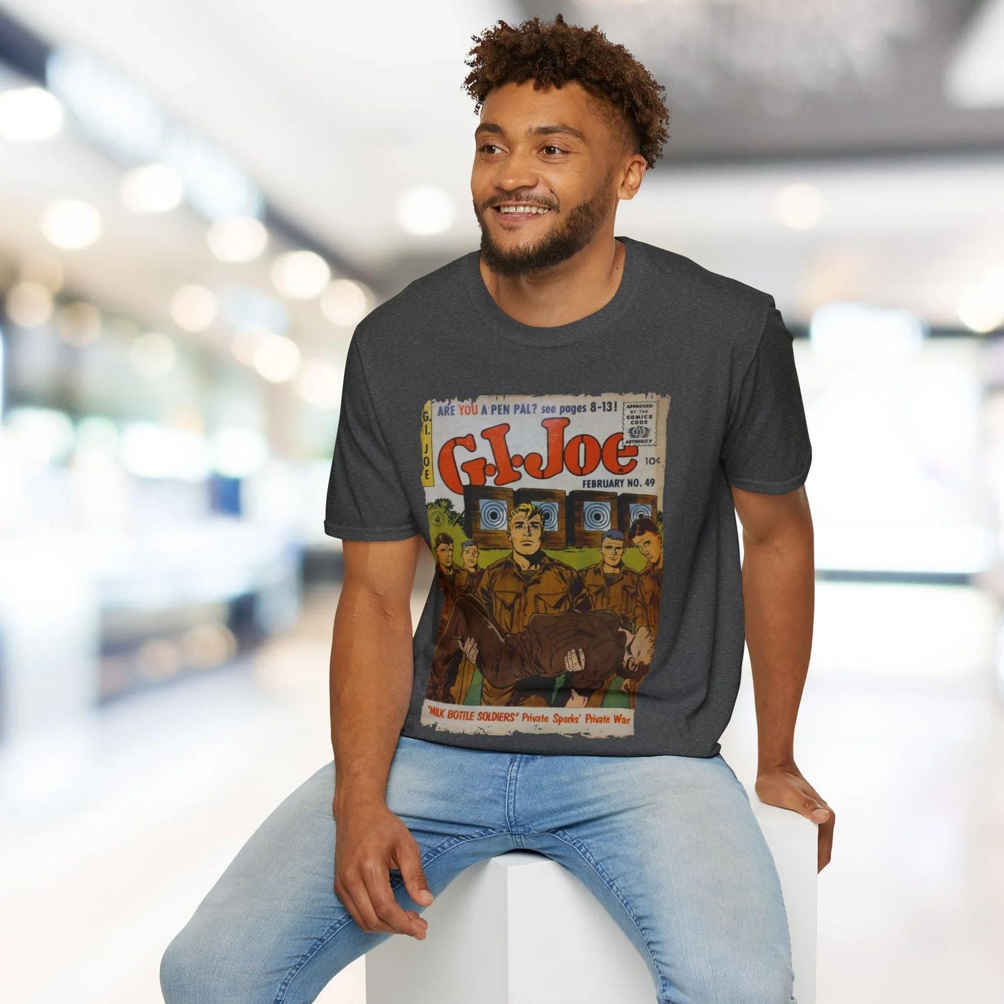 Close-up of the G.I. Joe No.49 logo printed on the soft cotton fabric of the relaxed fit, heather navy unisex T-shirt