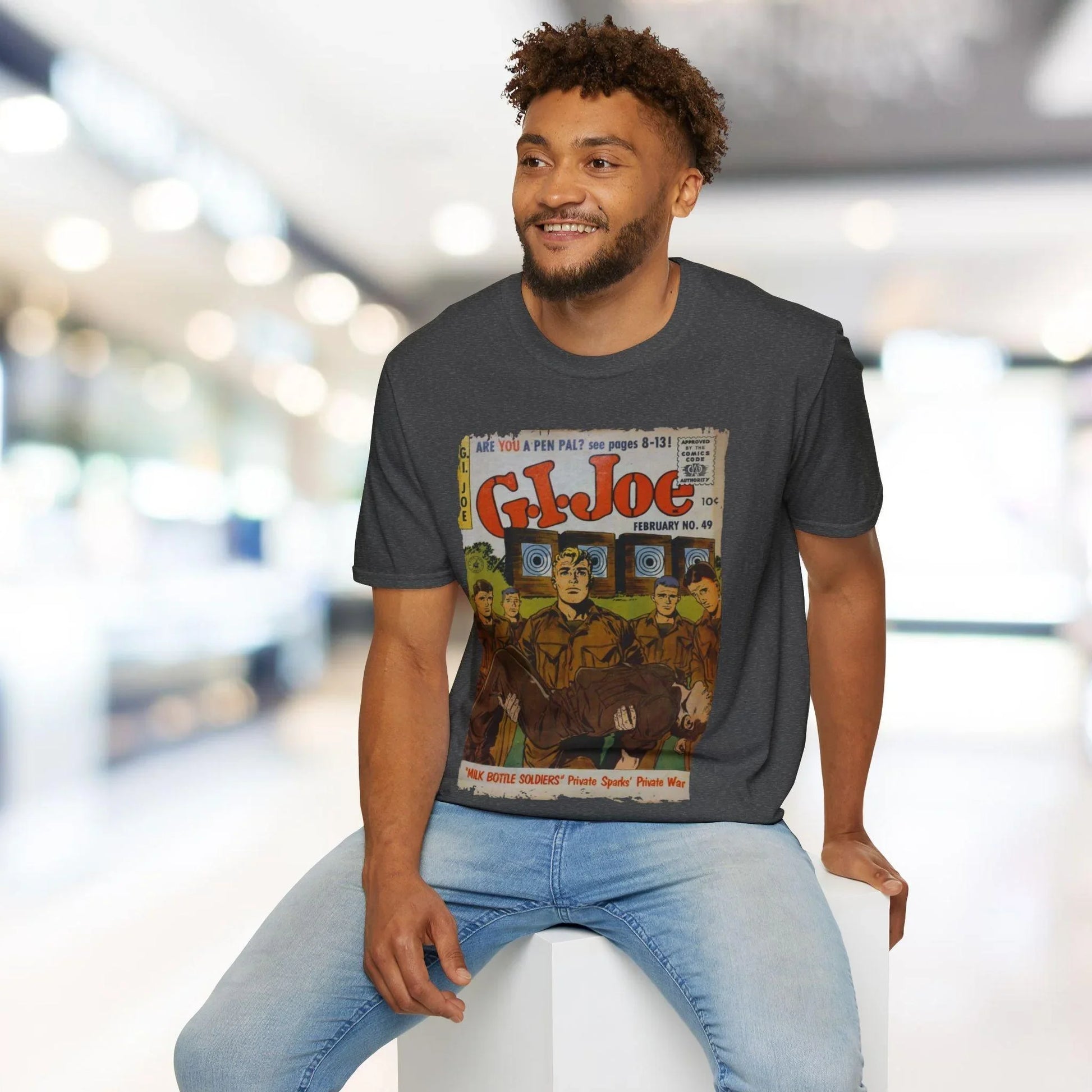 Close-up of the G.I. Joe No.49 logo printed on the soft cotton fabric of the relaxed fit, heather navy unisex T-shirt