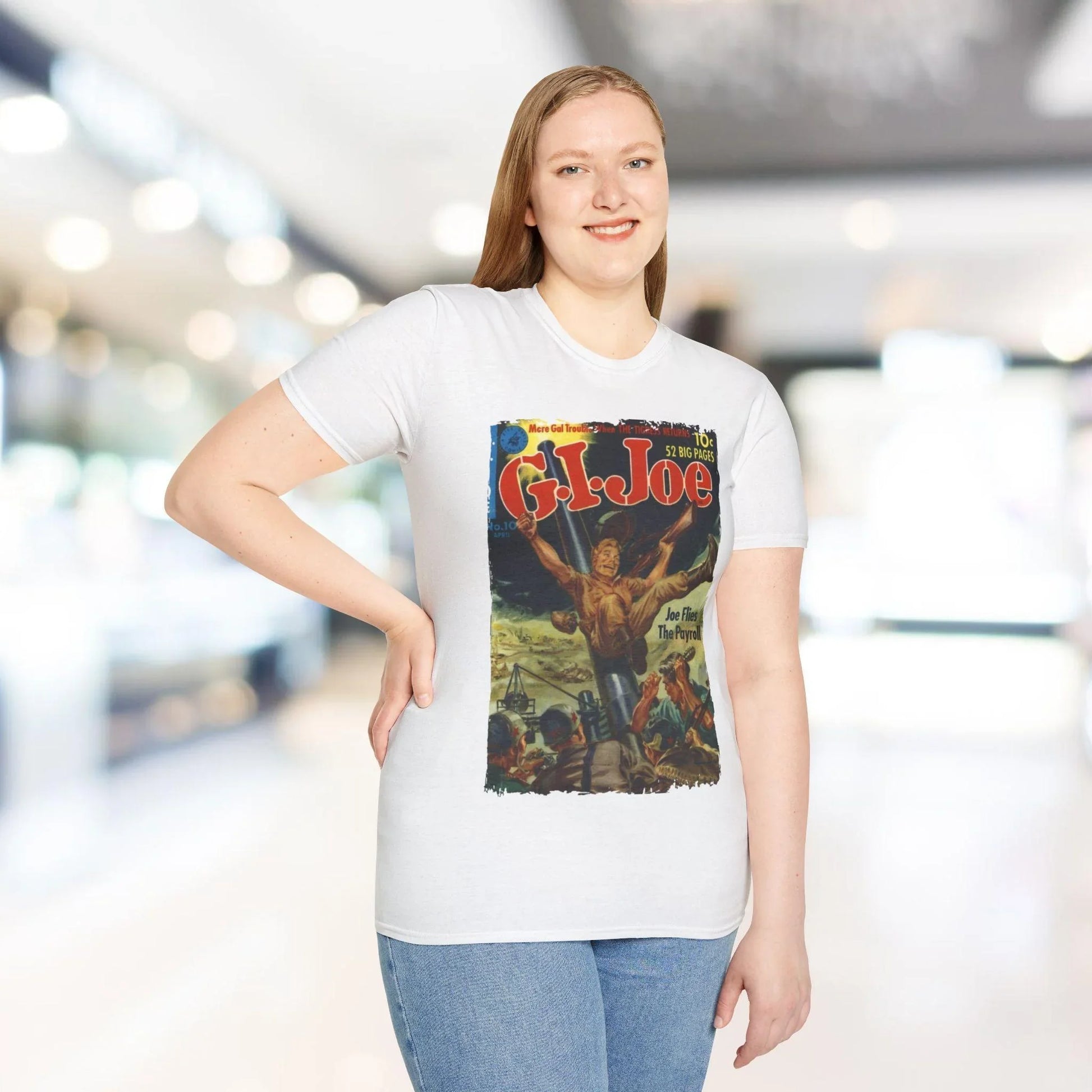 Close-up of the G.I. Joe No.10 Apr unisex softstyle T-shirt's white sewn-in label on the relaxed-fit fabric with a hint of