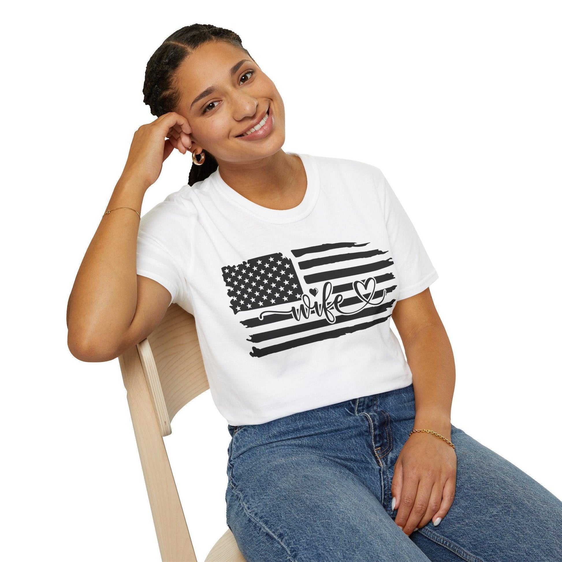 Close-up of distressed black-and-white American flag print on unisex softstyle T-shirt, highlighting faded fabric texture