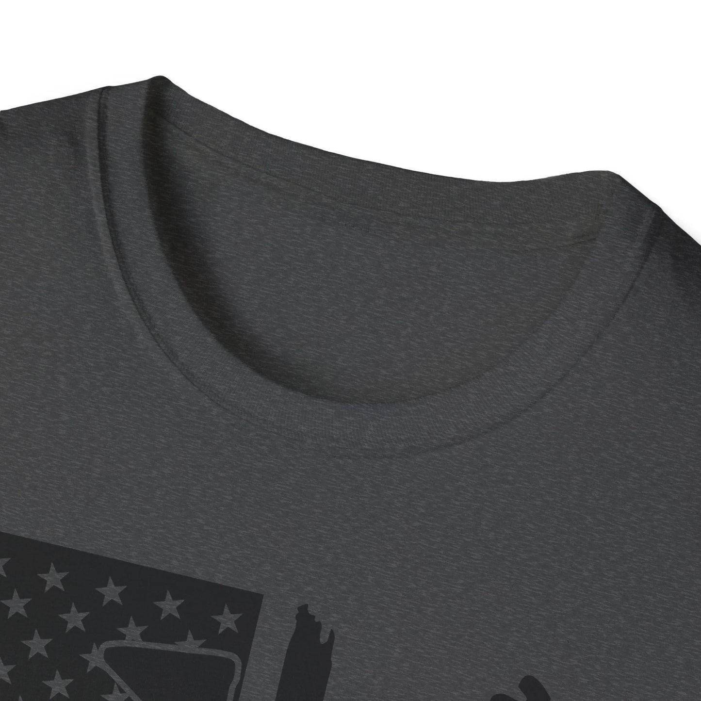 Close-up of the distressed black and white American flag graphic on the chest of the unisex softstyle T-shirt, highlighting