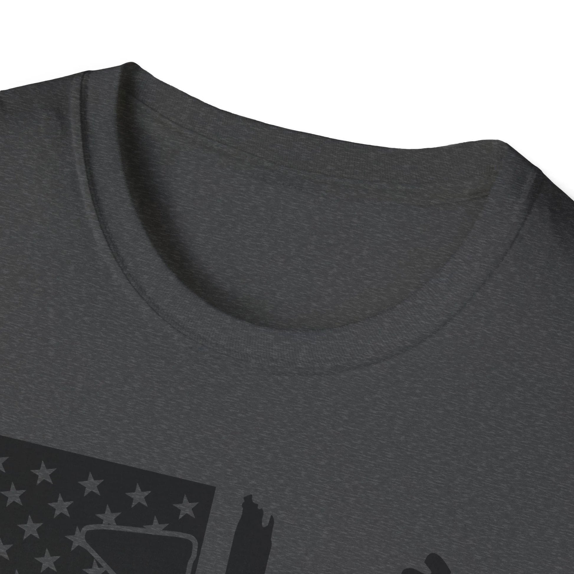 Close-up of the distressed black and white American flag graphic on the chest of the unisex softstyle T-shirt, highlighting