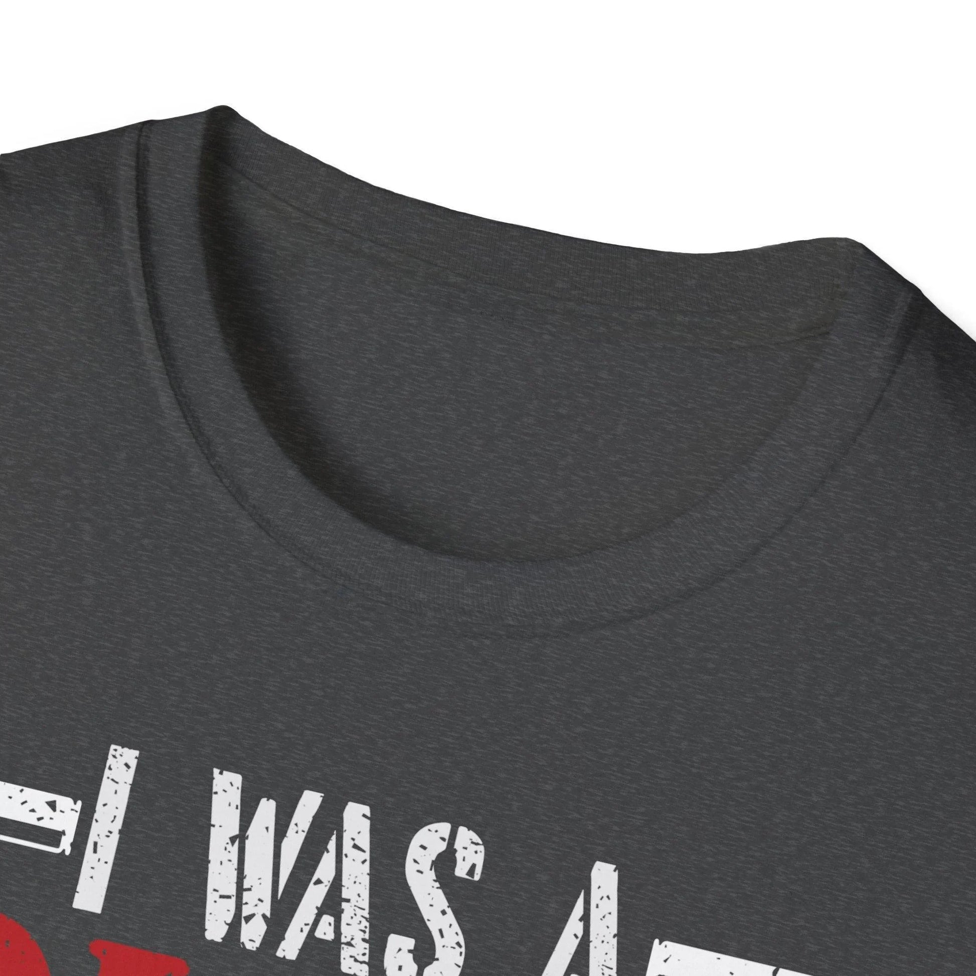 Close-up of the charcoal gray fabric's soft texture and subtle stitching details on the unisex T-shirt’s relaxed fit neckline