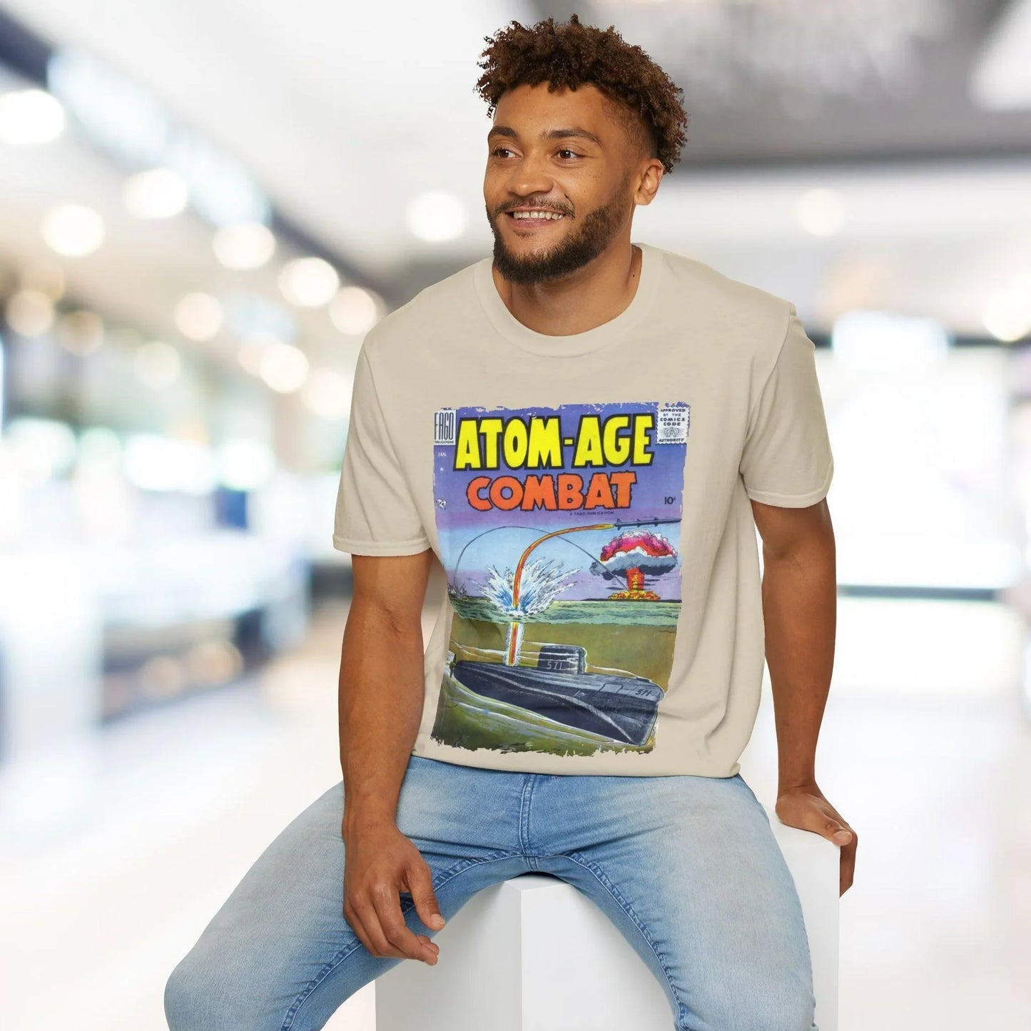 Close-up of the unisex softstyle cotton fabric texture and subtle seam detailing at the hem of the Atom-Age Combat No.2