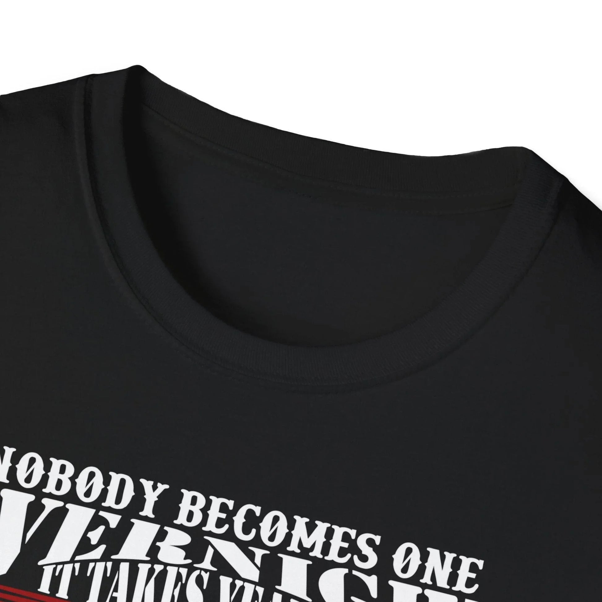 Close-up of the unisex fit tag sewn at the hem of the slate gray, relaxed-fit softstyle cotton T-shirt showcasing fabric