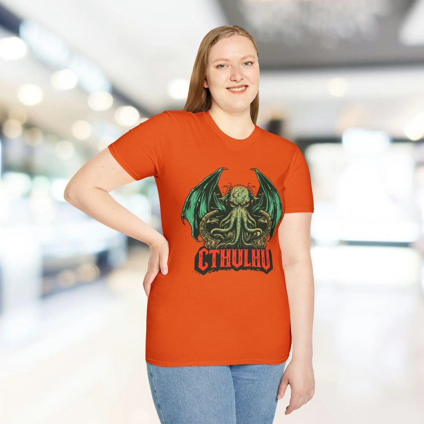 Close-up of Cthulhu graphic detail on black relaxed-fit unisex t-shirt’s chest area, highlighting vibrant print on soft