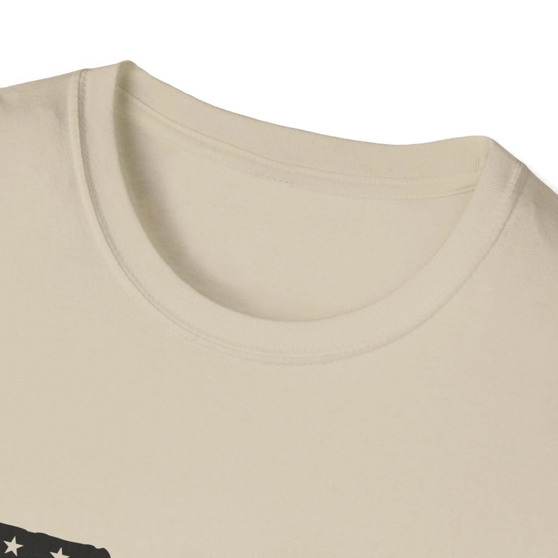 Close-up of black and white American flag gun graphic on the chest of the unisex softstyle T-shirt with crew neckline and