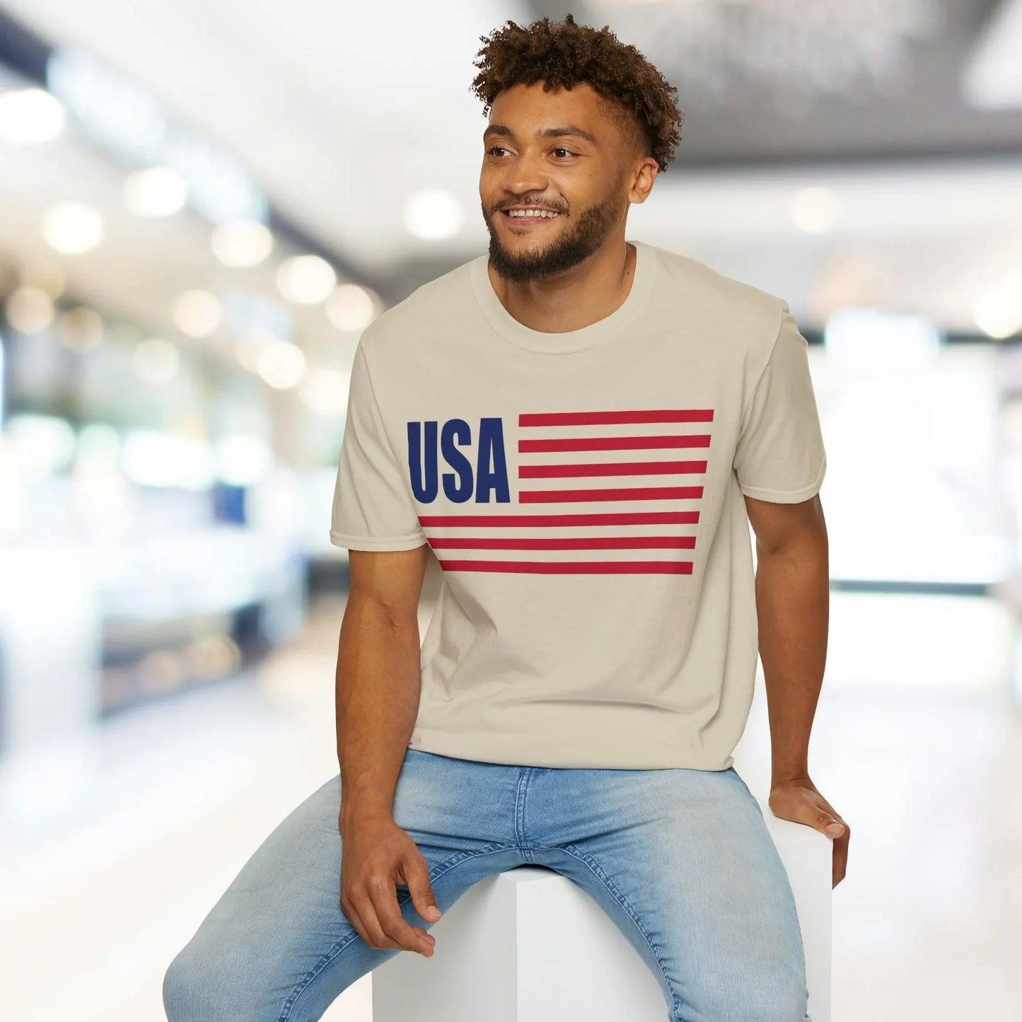Close-up of the American flag graphic on the chest of the unisex softstyle T-shirt, showcasing vibrant colors and detailed