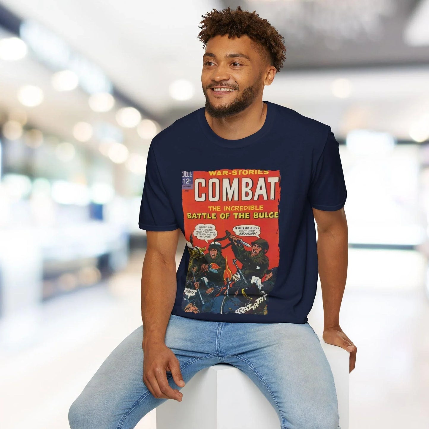 Close-up of the soft cotton fabric and reinforced neckline stitching on the relaxed fit, dark navy color, short sleeves.