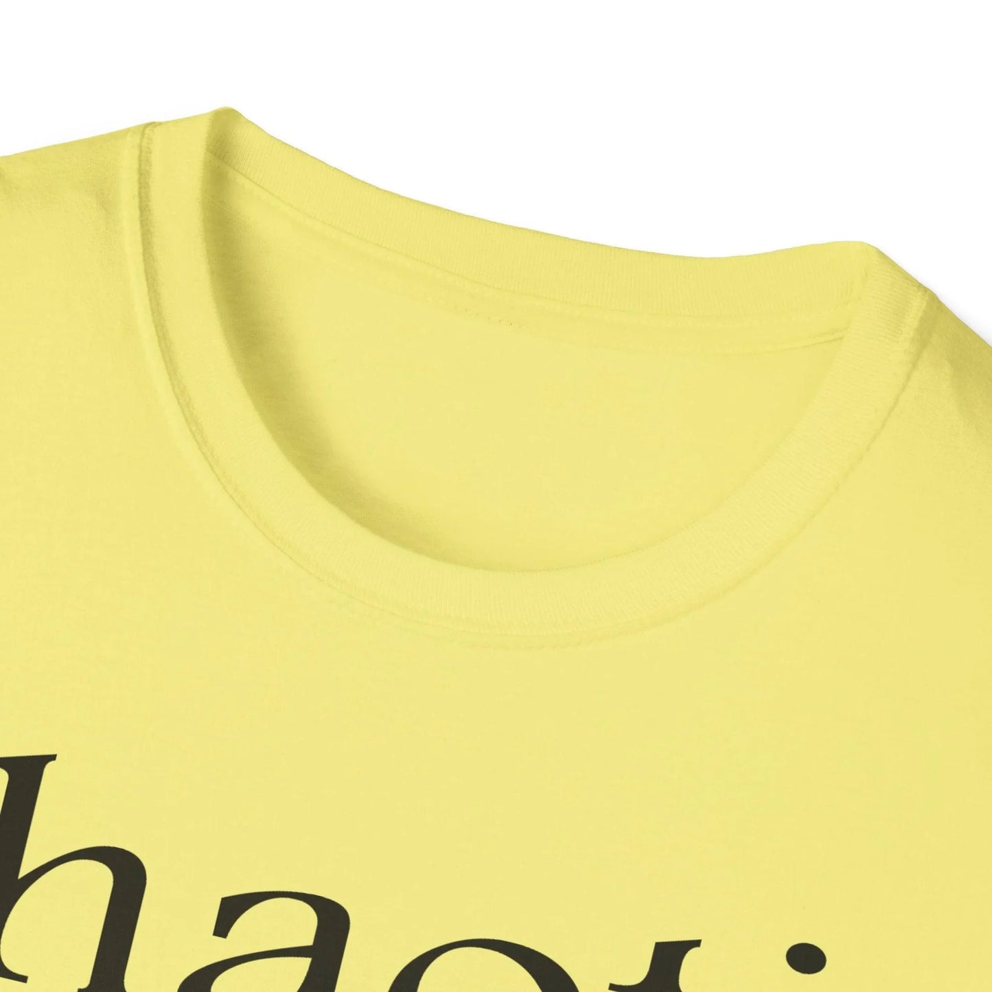 Close-up of the black cotton fabric texture highlighting the relaxed fit and subtle stitching detail on the collar neckline.