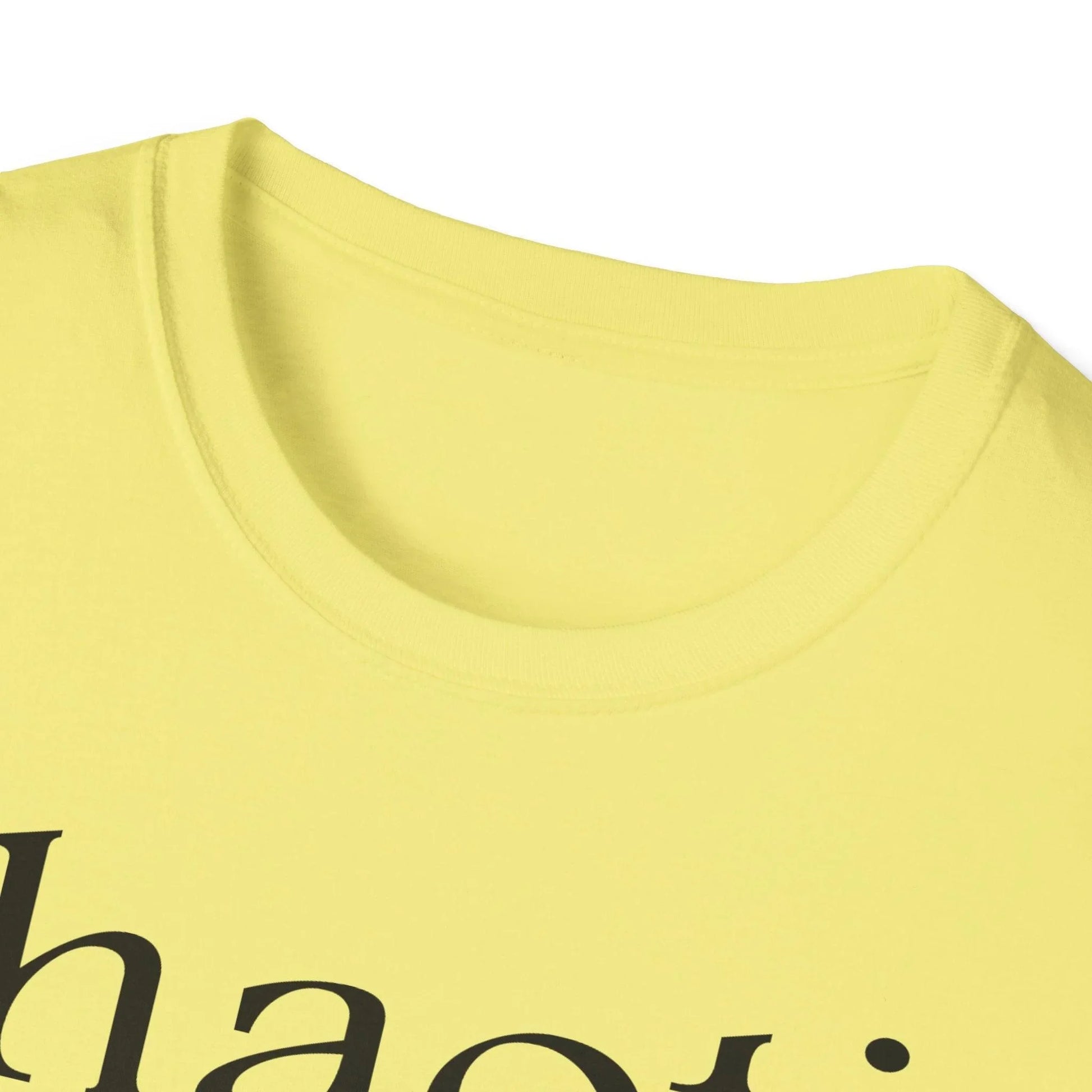 Close-up of the black cotton fabric texture highlighting the relaxed fit and subtle stitching detail on the collar neckline.