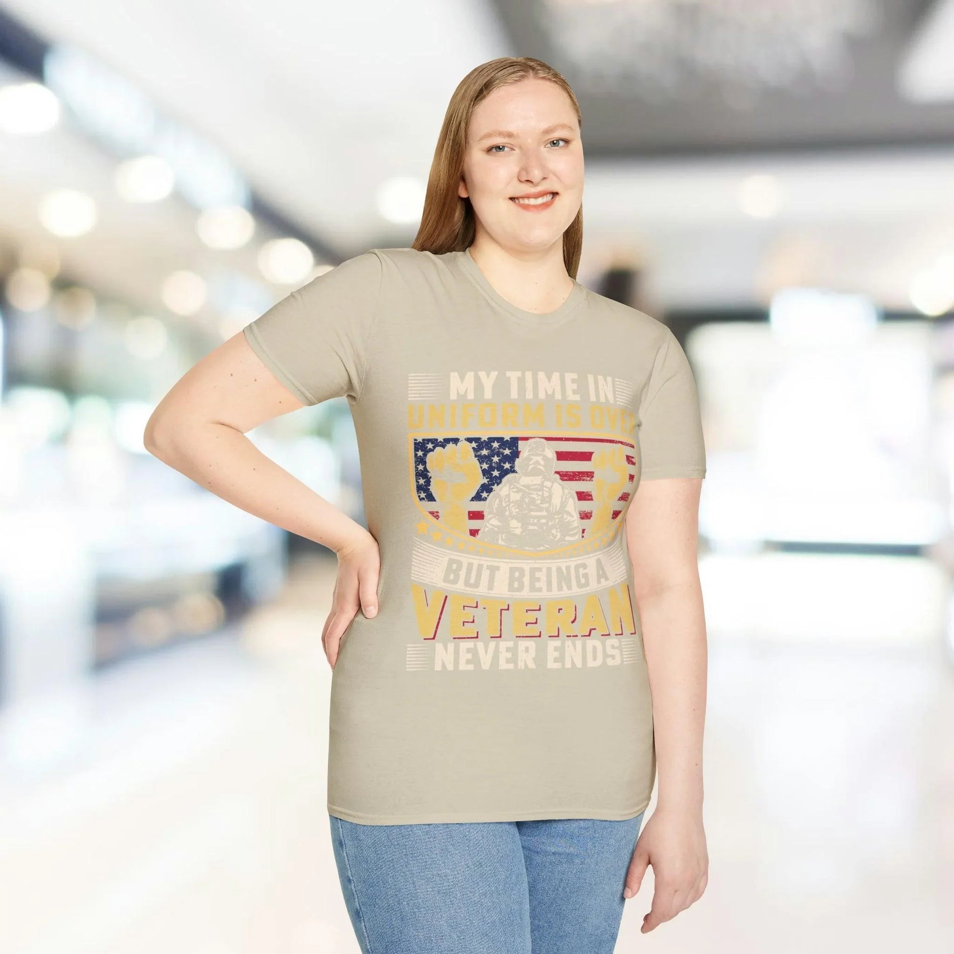 Close-up of the unisex softstyle fabric tag on the back neckline, showcasing the smooth white cotton blend and neat