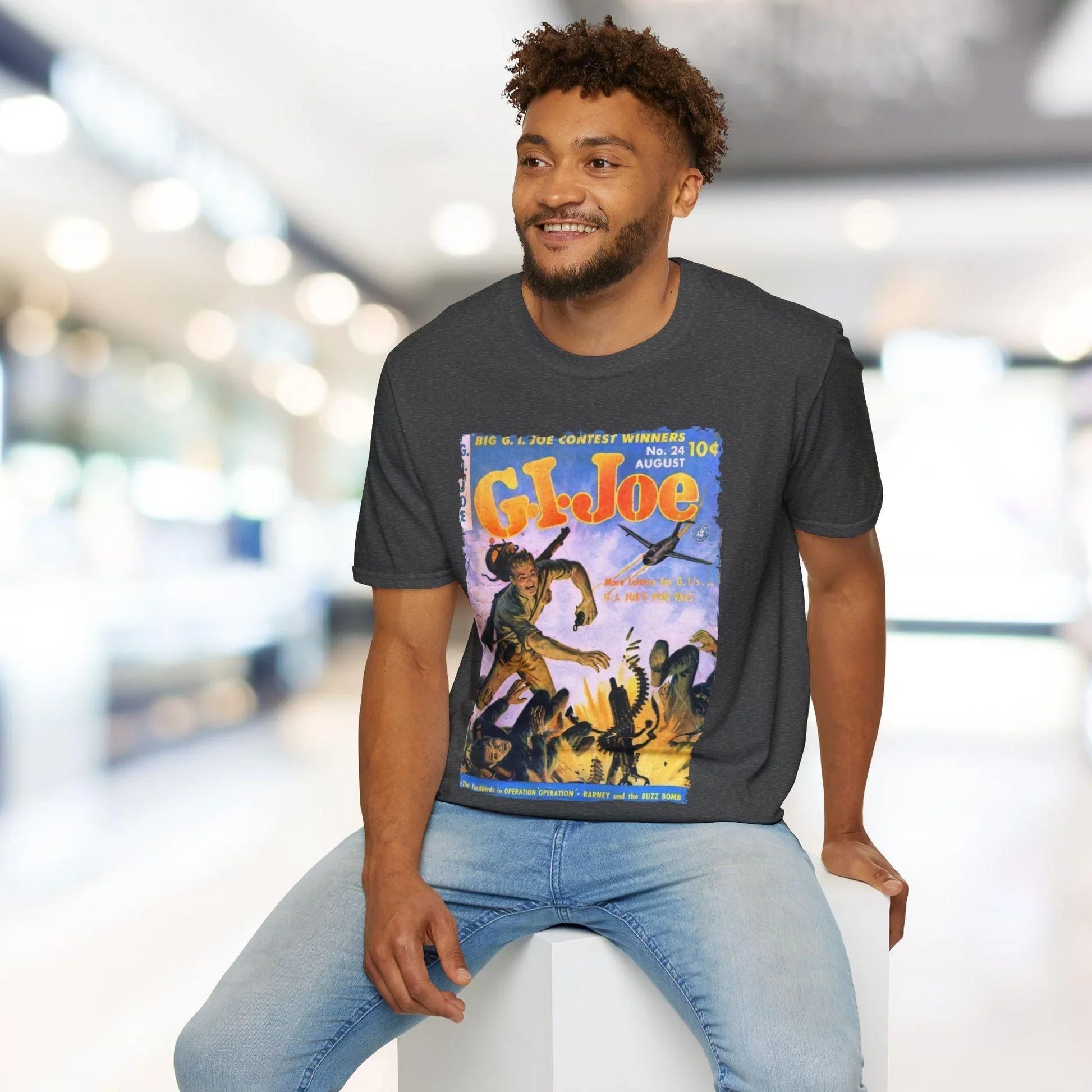 Close-up of the G.I. Joe No.24 T-shirt tag highlighting the unisex fit and soft cotton blend fabric in olive green color.