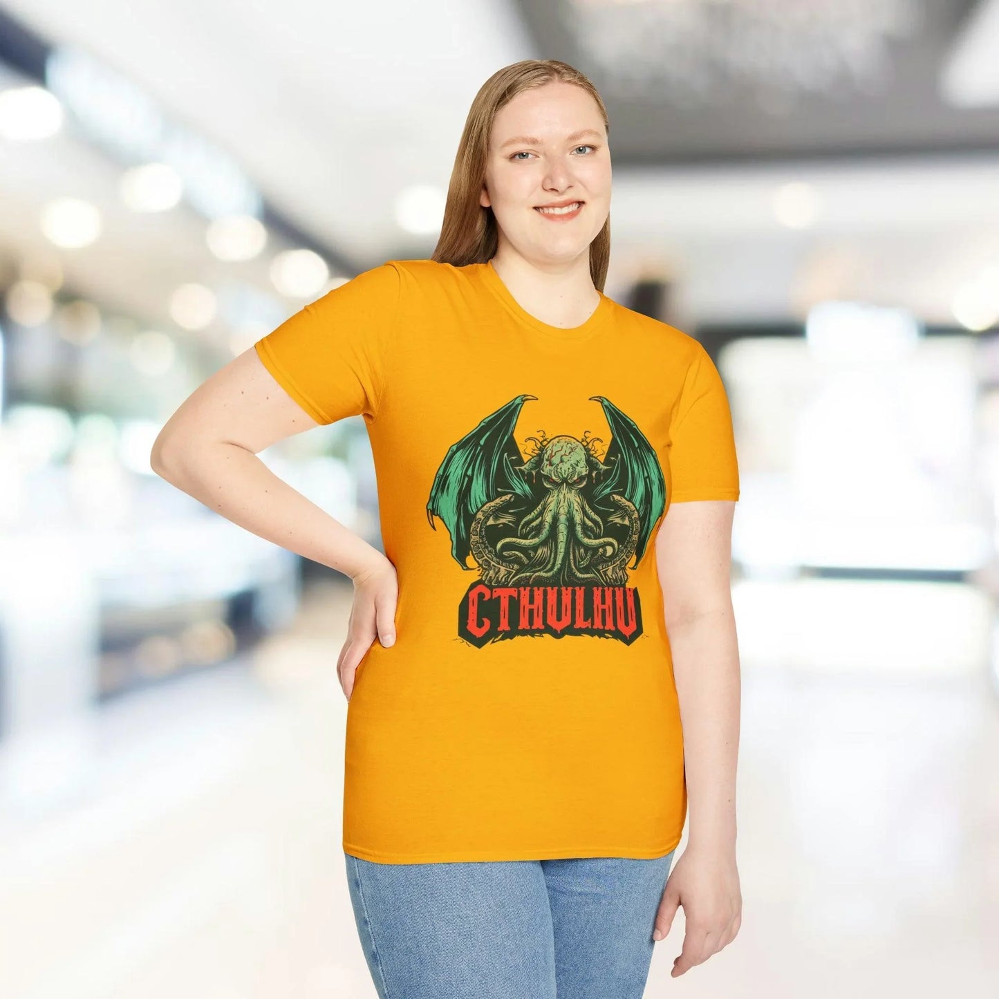 Close-up of Cthulhu ink illustration on the relaxed fit forest green cotton T-shirt’s front neckline detail