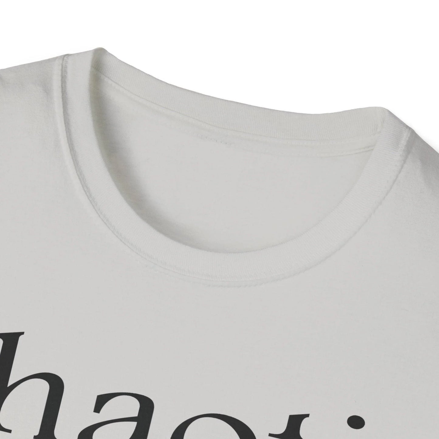 Close-up of the black unisex softstyle T-shirt's fabric texture and subtle stitching detail at the sleeve hem from a